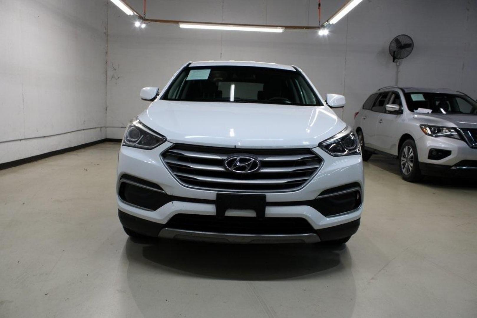 2018 Pearl White /Gray Hyundai Santa Fe Sport 2.4 Base (5XYZT3LB5JG) with an 2.4L I4 DGI DOHC 16V engine, Automatic transmission, located at 15300 Midway Rd., Addison, TX, 75001, (972) 702-0011, 32.958321, -96.838074 - 2018 Hyundai Santa Fe Sport<br>Now Available at Midway Auto Group Addison, Texas<br><br>Spacious, stylish, and versatile, the 2018 Hyundai Santa Fe Sport is a midsize SUV designed to handle daily commutes, weekend getaways, and everything in between. With a comfortable cabin, modern technology, and - Photo#5