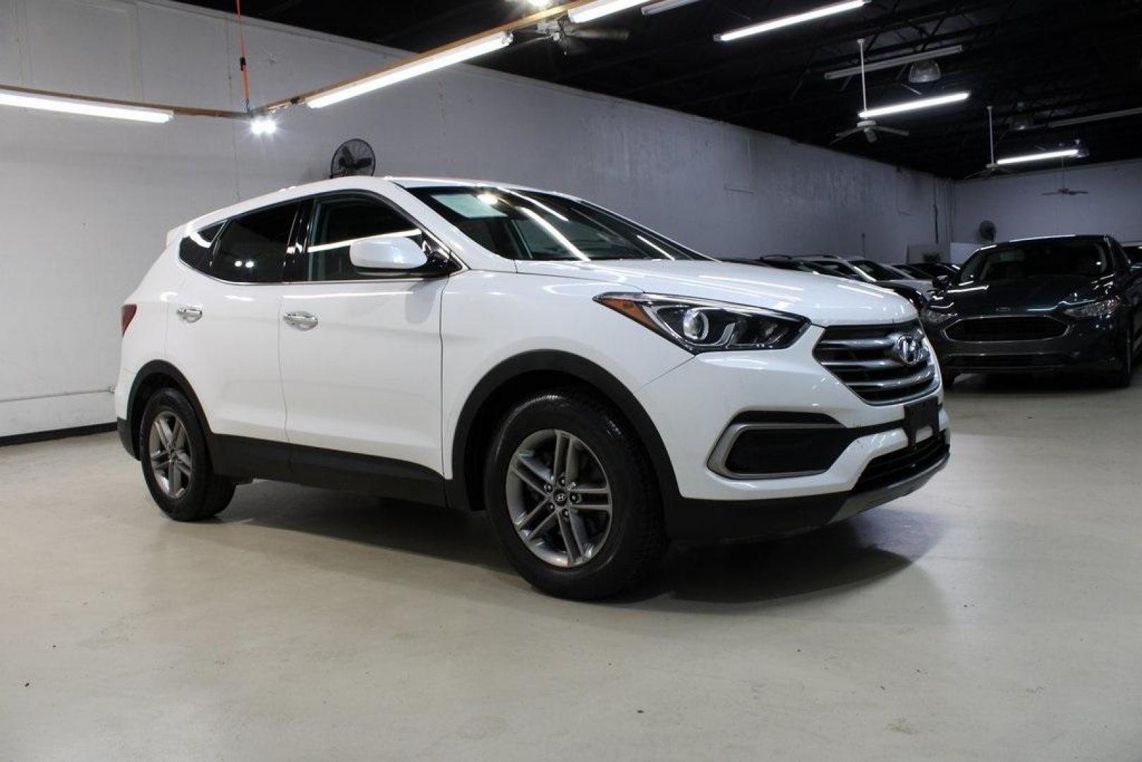2018 Pearl White /Gray Hyundai Santa Fe Sport 2.4 Base (5XYZT3LB5JG) with an 2.4L I4 DGI DOHC 16V engine, Automatic transmission, located at 15300 Midway Rd., Addison, TX, 75001, (972) 702-0011, 32.958321, -96.838074 - 2018 Hyundai Santa Fe Sport<br>Now Available at Midway Auto Group Addison, Texas<br><br>Spacious, stylish, and versatile, the 2018 Hyundai Santa Fe Sport is a midsize SUV designed to handle daily commutes, weekend getaways, and everything in between. With a comfortable cabin, modern technology, and - Photo#6