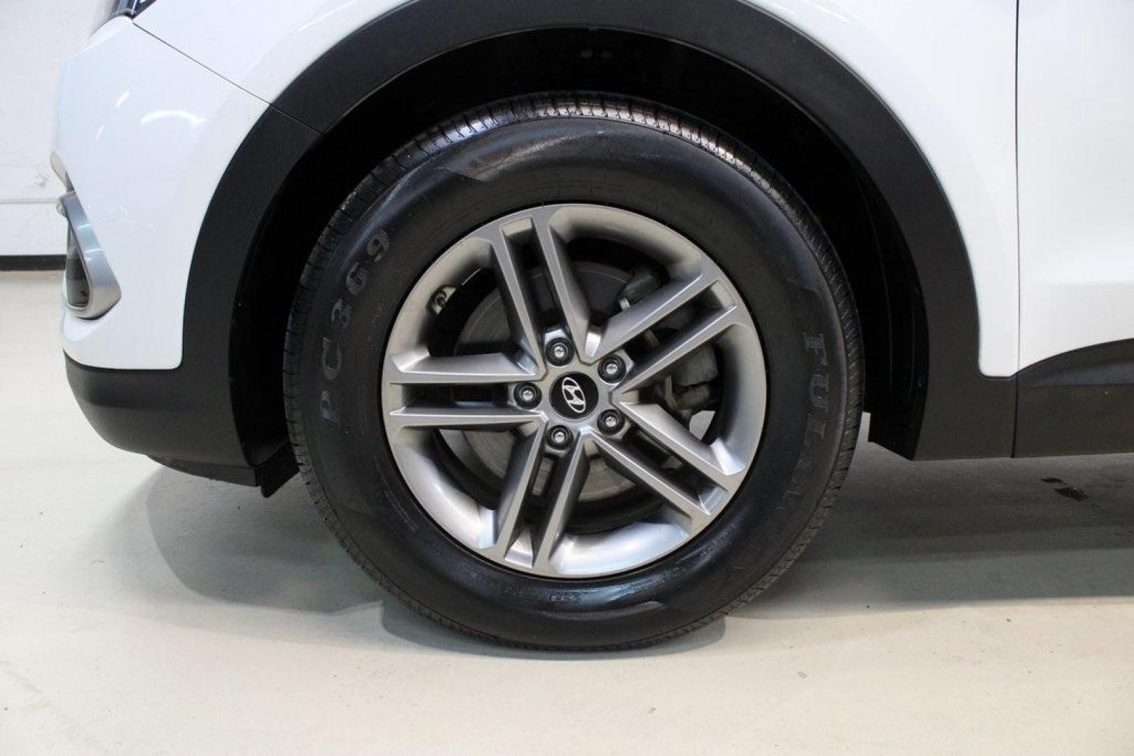 2018 Pearl White /Gray Hyundai Santa Fe Sport 2.4 Base (5XYZT3LB5JG) with an 2.4L I4 DGI DOHC 16V engine, Automatic transmission, located at 15300 Midway Rd., Addison, TX, 75001, (972) 702-0011, 32.958321, -96.838074 - 2018 Hyundai Santa Fe Sport<br>Now Available at Midway Auto Group Addison, Texas<br><br>Spacious, stylish, and versatile, the 2018 Hyundai Santa Fe Sport is a midsize SUV designed to handle daily commutes, weekend getaways, and everything in between. With a comfortable cabin, modern technology, and - Photo#8