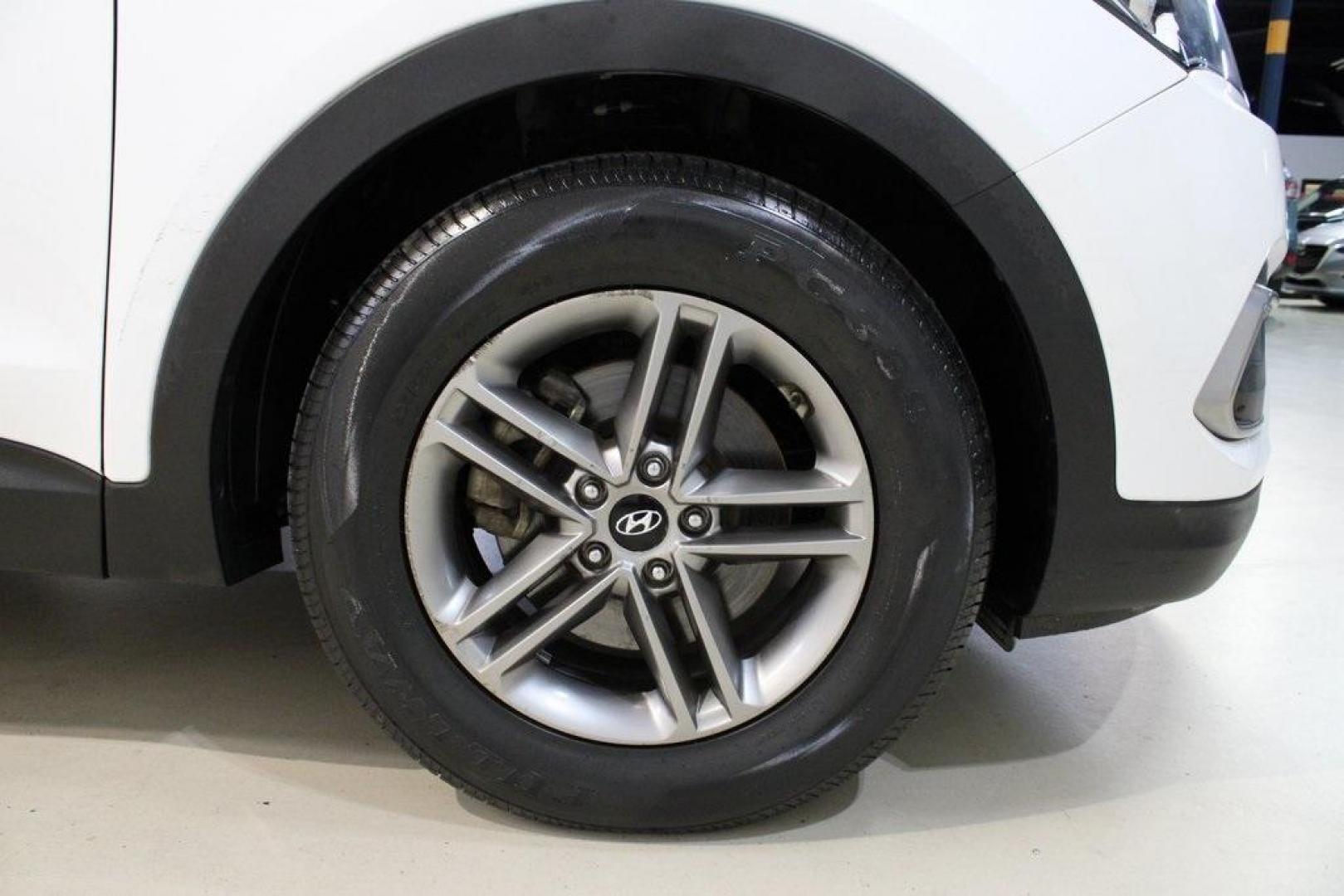 2018 Pearl White /Gray Hyundai Santa Fe Sport 2.4 Base (5XYZT3LB5JG) with an 2.4L I4 DGI DOHC 16V engine, Automatic transmission, located at 15300 Midway Rd., Addison, TX, 75001, (972) 702-0011, 32.958321, -96.838074 - 2018 Hyundai Santa Fe Sport<br>Now Available at Midway Auto Group Addison, Texas<br><br>Spacious, stylish, and versatile, the 2018 Hyundai Santa Fe Sport is a midsize SUV designed to handle daily commutes, weekend getaways, and everything in between. With a comfortable cabin, modern technology, and - Photo#12