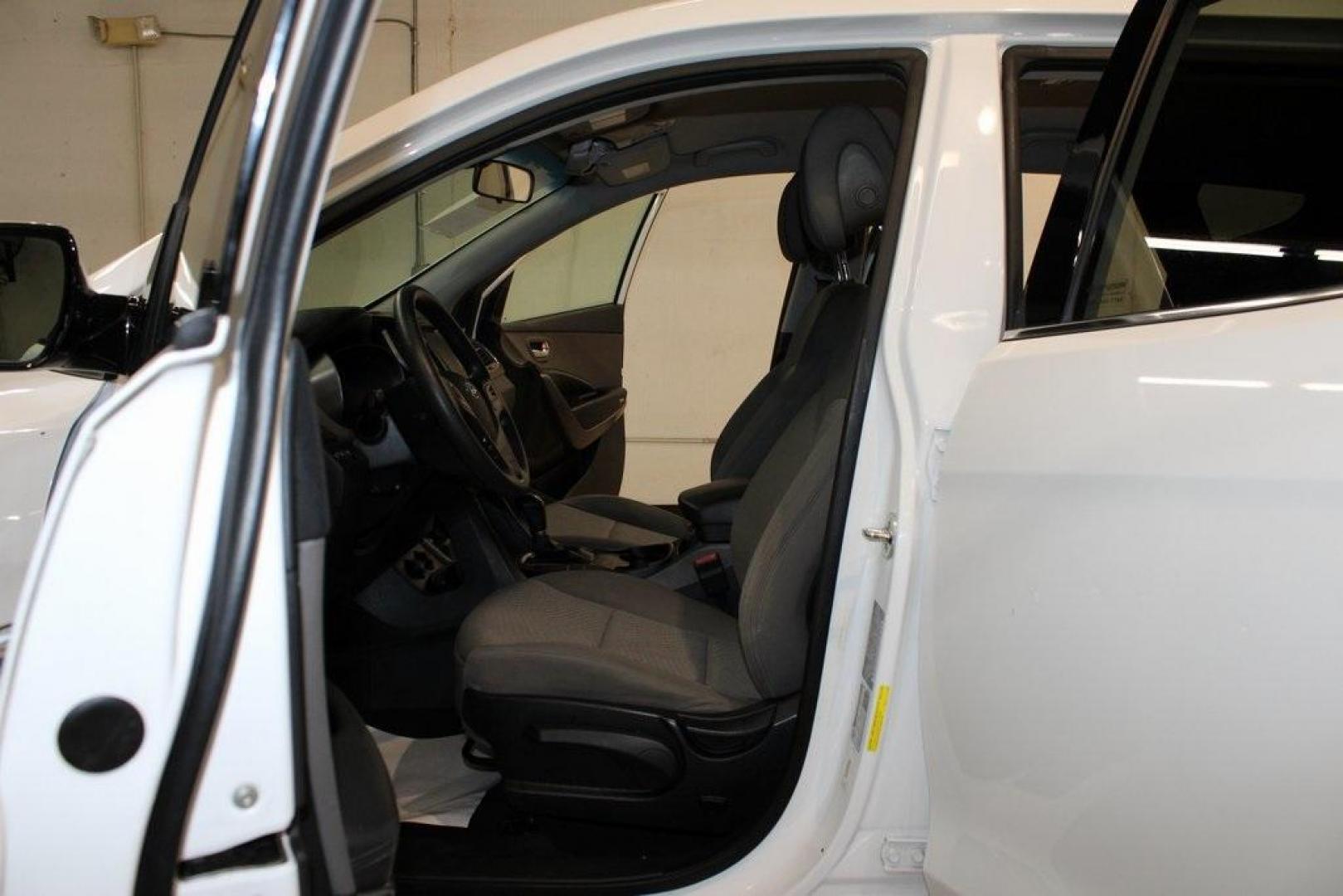2018 Pearl White /Gray Hyundai Santa Fe Sport 2.4 Base (5XYZT3LB5JG) with an 2.4L I4 DGI DOHC 16V engine, Automatic transmission, located at 15300 Midway Rd., Addison, TX, 75001, (972) 702-0011, 32.958321, -96.838074 - 2018 Hyundai Santa Fe Sport<br>Now Available at Midway Auto Group Addison, Texas<br><br>Spacious, stylish, and versatile, the 2018 Hyundai Santa Fe Sport is a midsize SUV designed to handle daily commutes, weekend getaways, and everything in between. With a comfortable cabin, modern technology, and - Photo#13