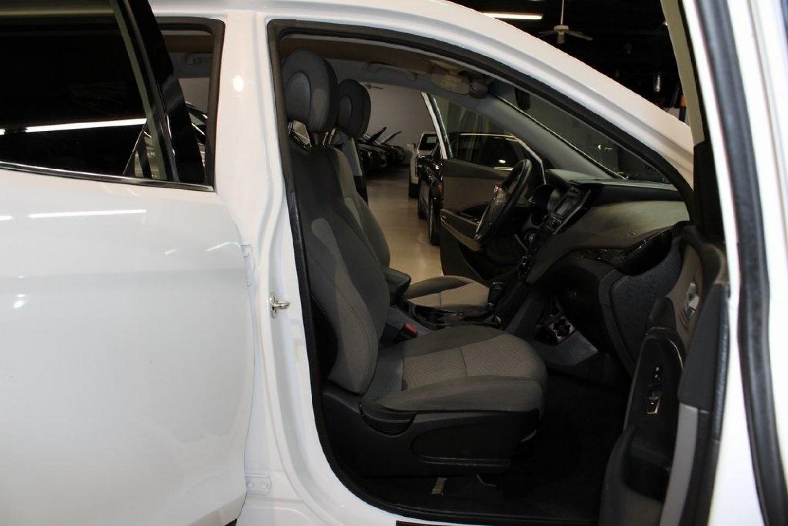 2018 Pearl White /Gray Hyundai Santa Fe Sport 2.4 Base (5XYZT3LB5JG) with an 2.4L I4 DGI DOHC 16V engine, Automatic transmission, located at 15300 Midway Rd., Addison, TX, 75001, (972) 702-0011, 32.958321, -96.838074 - 2018 Hyundai Santa Fe Sport<br>Now Available at Midway Auto Group Addison, Texas<br><br>Spacious, stylish, and versatile, the 2018 Hyundai Santa Fe Sport is a midsize SUV designed to handle daily commutes, weekend getaways, and everything in between. With a comfortable cabin, modern technology, and - Photo#14