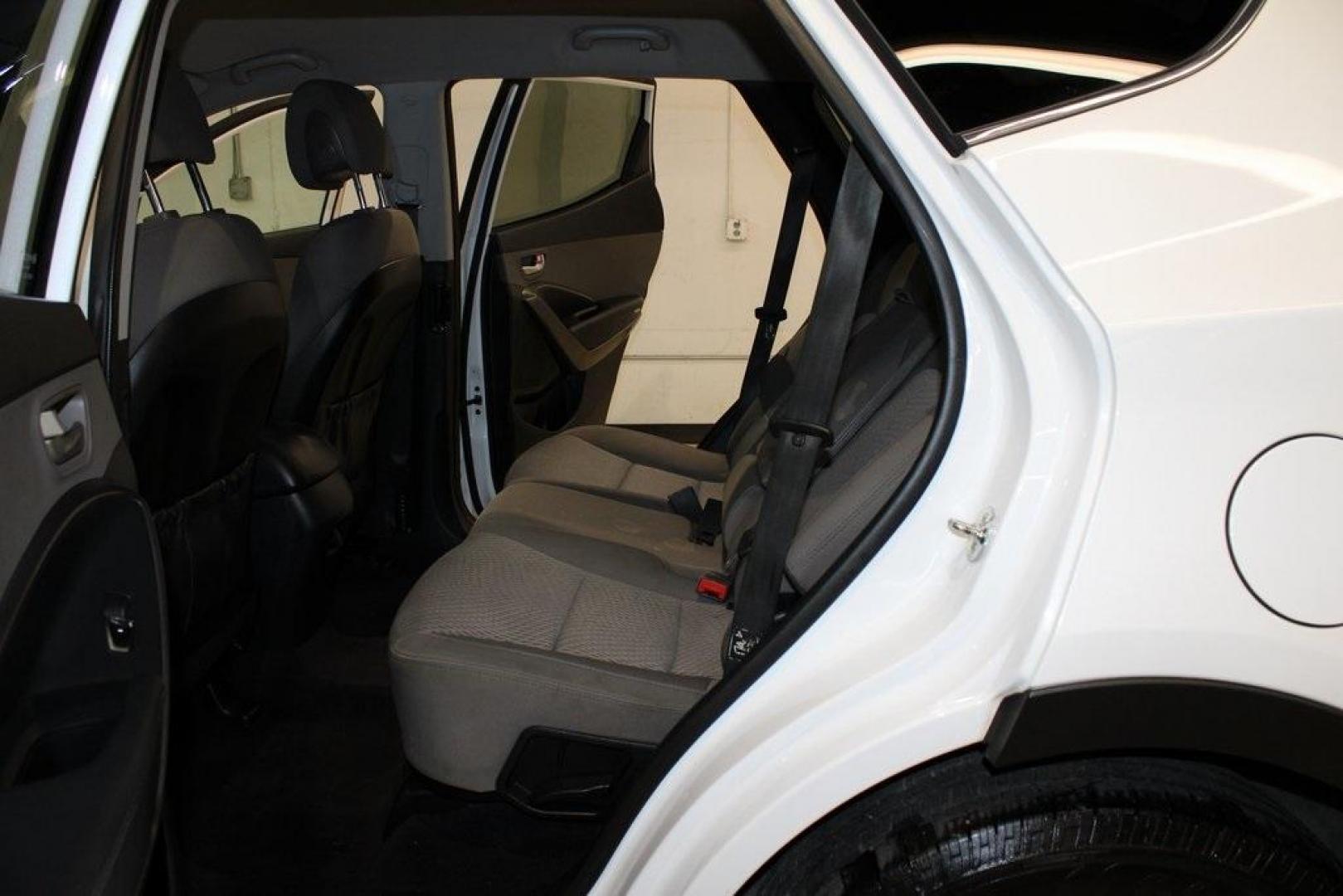 2018 Pearl White /Gray Hyundai Santa Fe Sport 2.4 Base (5XYZT3LB5JG) with an 2.4L I4 DGI DOHC 16V engine, Automatic transmission, located at 15300 Midway Rd., Addison, TX, 75001, (972) 702-0011, 32.958321, -96.838074 - 2018 Hyundai Santa Fe Sport<br>Now Available at Midway Auto Group Addison, Texas<br><br>Spacious, stylish, and versatile, the 2018 Hyundai Santa Fe Sport is a midsize SUV designed to handle daily commutes, weekend getaways, and everything in between. With a comfortable cabin, modern technology, and - Photo#16