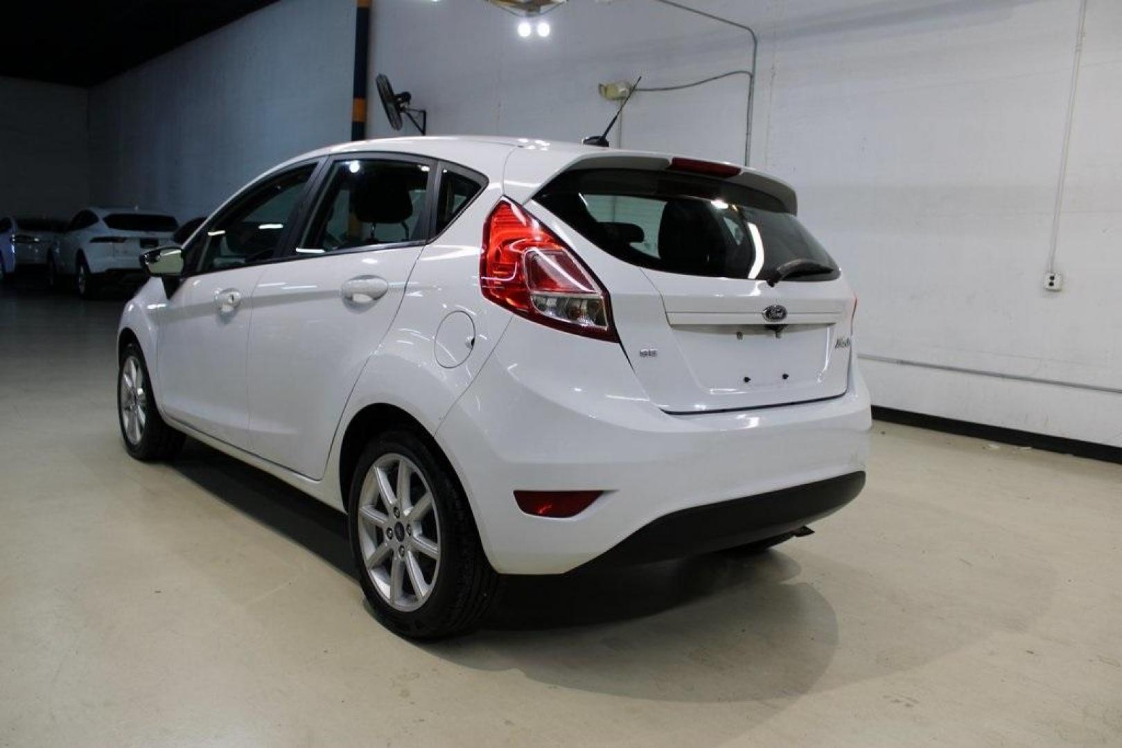 2019 Oxford White /Black Ford Fiesta SE (3FADP4EJXKM) with an 1.6L I4 Ti-VCT engine, Automatic transmission, located at 15300 Midway Rd., Addison, TX, 75001, (972) 702-0011, 32.958321, -96.838074 - Photo#2