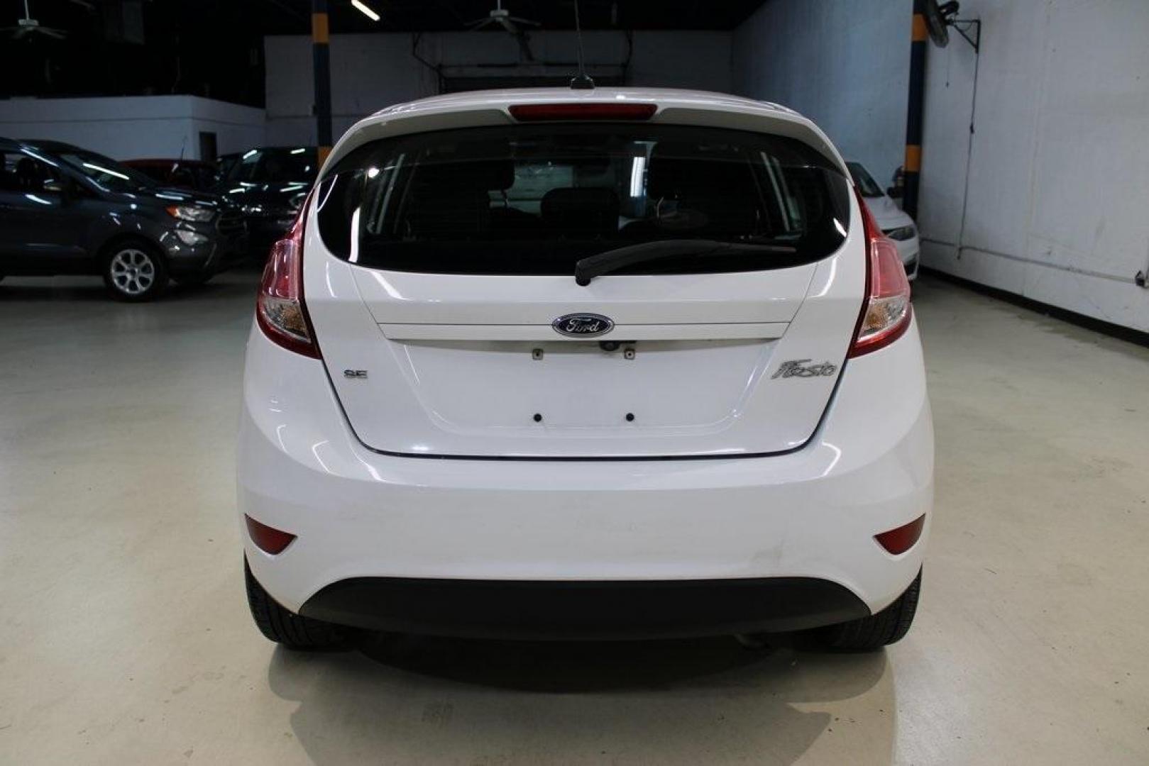 2019 Oxford White /Black Ford Fiesta SE (3FADP4EJXKM) with an 1.6L I4 Ti-VCT engine, Automatic transmission, located at 15300 Midway Rd., Addison, TX, 75001, (972) 702-0011, 32.958321, -96.838074 - Photo#6