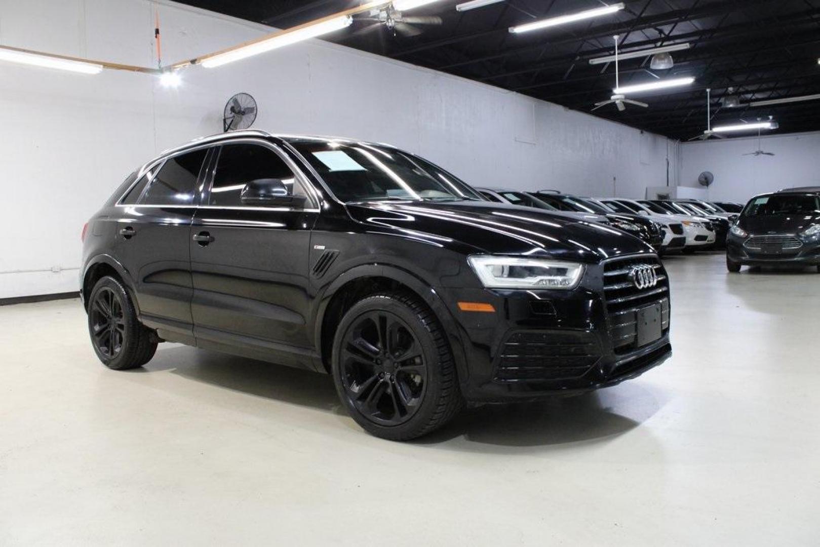2016 Brilliant Black /Black Audi Q3 2.0T Prestige (WA1FFCFS4GR) with an 2.0L 4-Cylinder TFSI engine, Automatic transmission, located at 15300 Midway Rd., Addison, TX, 75001, (972) 702-0011, 32.958321, -96.838074 - HOME OF THE NO HAGGLE PRICE - WHOLESALE PRICES TO THE PUBLIC!!<br><br>Brilliant Black 2016 Audi Q3 2.0T Prestige<br><br>20/29 City/Highway MPG<br><br>Awards:<br> * JD Power Initial Quality Study (IQS), Vehicle Dependability Study * JD Power Initial Quality Study (IQS), Vehicle Dependability Study - Photo#6