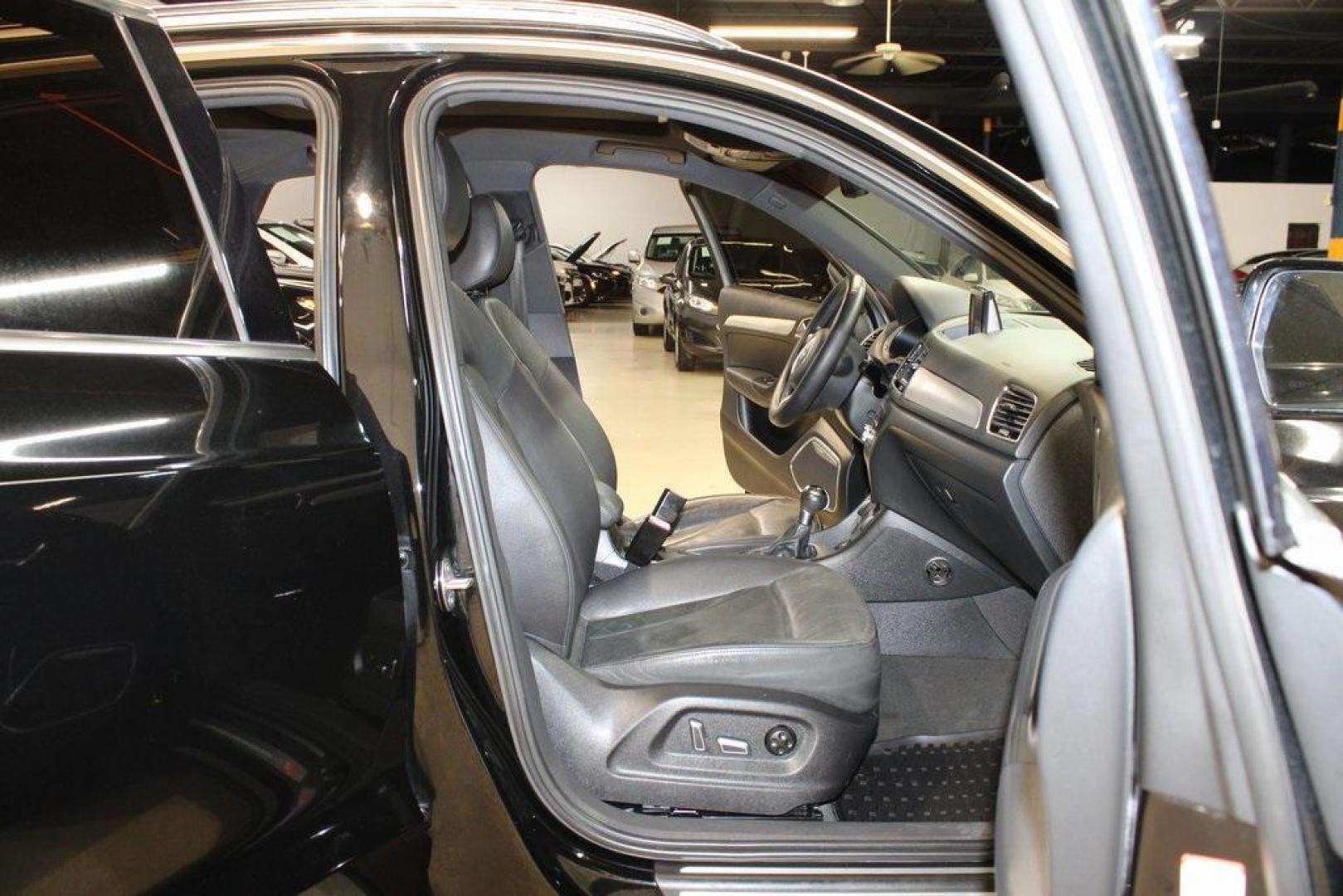 2016 Brilliant Black /Black Audi Q3 2.0T Prestige (WA1FFCFS4GR) with an 2.0L 4-Cylinder TFSI engine, Automatic transmission, located at 15300 Midway Rd., Addison, TX, 75001, (972) 702-0011, 32.958321, -96.838074 - HOME OF THE NO HAGGLE PRICE - WHOLESALE PRICES TO THE PUBLIC!!<br><br>Brilliant Black 2016 Audi Q3 2.0T Prestige<br><br>20/29 City/Highway MPG<br><br>Awards:<br> * JD Power Initial Quality Study (IQS), Vehicle Dependability Study * JD Power Initial Quality Study (IQS), Vehicle Dependability Study - Photo#14