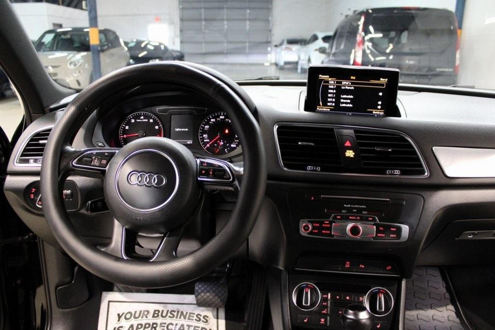 2016 Brilliant Black /Black Audi Q3 2.0T Prestige (WA1FFCFS4GR) with an 2.0L 4-Cylinder TFSI engine, Automatic transmission, located at 15300 Midway Rd., Addison, TX, 75001, (972) 702-0011, 32.958321, -96.838074 - HOME OF THE NO HAGGLE PRICE - WHOLESALE PRICES TO THE PUBLIC!!<br><br>Brilliant Black 2016 Audi Q3 2.0T Prestige<br><br>20/29 City/Highway MPG<br><br>Awards:<br> * JD Power Initial Quality Study (IQS), Vehicle Dependability Study * JD Power Initial Quality Study (IQS), Vehicle Dependability Study - Photo#17