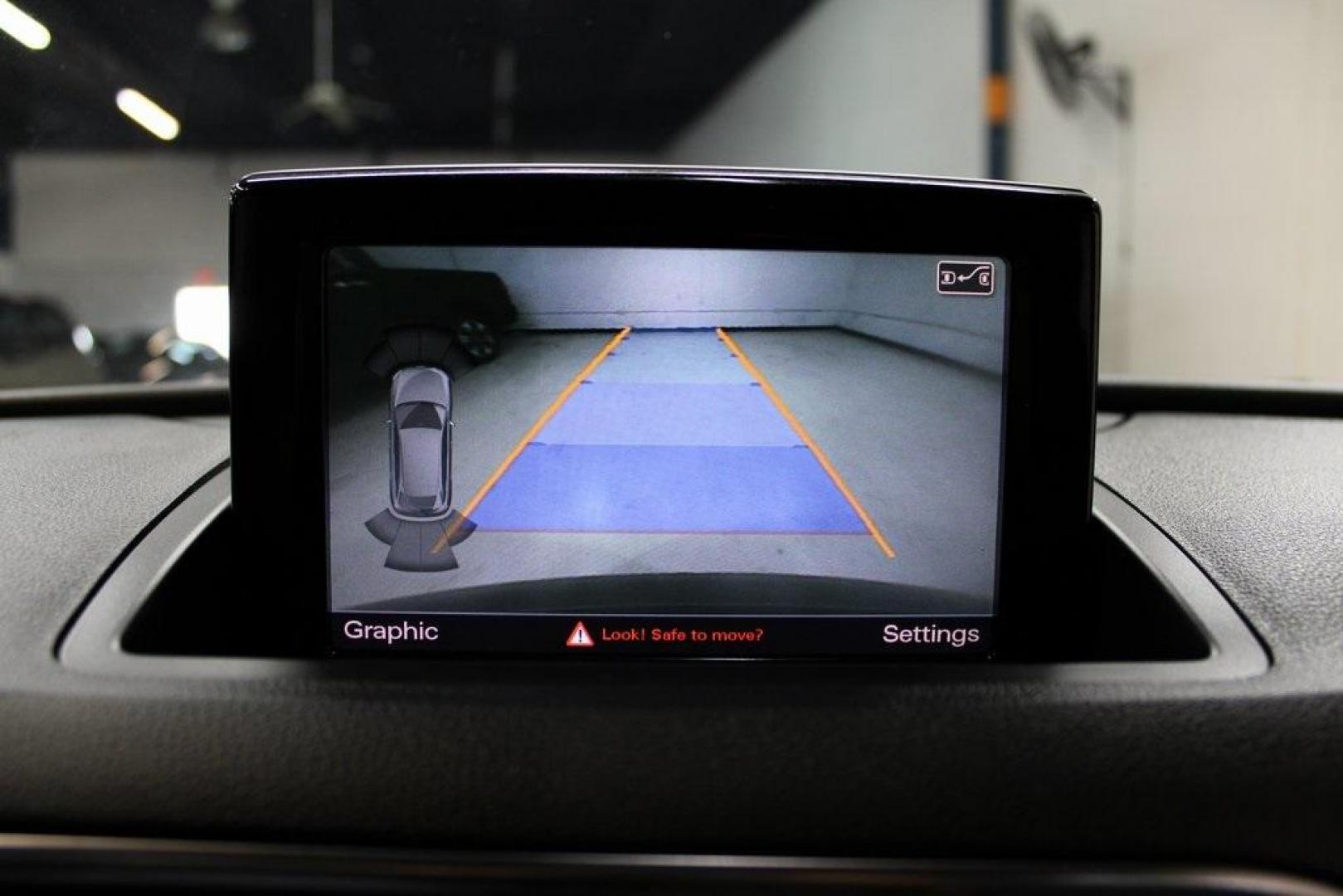 2016 Brilliant Black /Black Audi Q3 2.0T Prestige (WA1FFCFS4GR) with an 2.0L 4-Cylinder TFSI engine, Automatic transmission, located at 15300 Midway Rd., Addison, TX, 75001, (972) 702-0011, 32.958321, -96.838074 - HOME OF THE NO HAGGLE PRICE - WHOLESALE PRICES TO THE PUBLIC!!<br><br>Brilliant Black 2016 Audi Q3 2.0T Prestige<br><br>20/29 City/Highway MPG<br><br>Awards:<br> * JD Power Initial Quality Study (IQS), Vehicle Dependability Study * JD Power Initial Quality Study (IQS), Vehicle Dependability Study - Photo#19