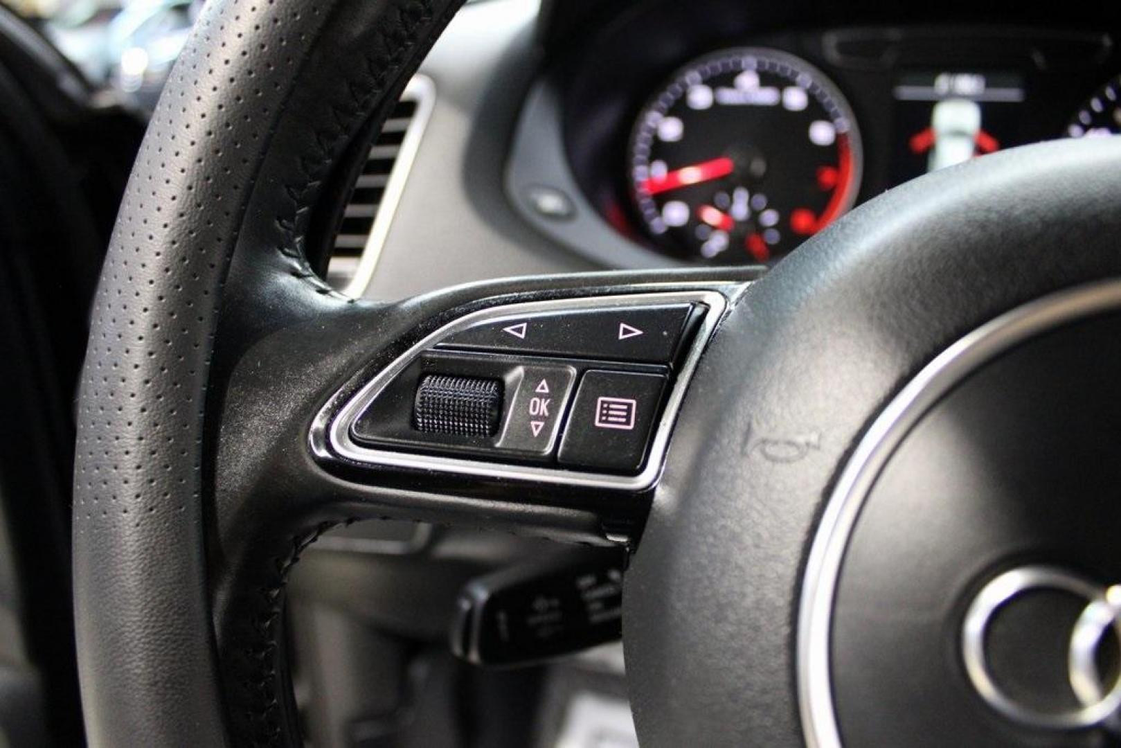 2016 Brilliant Black /Black Audi Q3 2.0T Prestige (WA1FFCFS4GR) with an 2.0L 4-Cylinder TFSI engine, Automatic transmission, located at 15300 Midway Rd., Addison, TX, 75001, (972) 702-0011, 32.958321, -96.838074 - HOME OF THE NO HAGGLE PRICE - WHOLESALE PRICES TO THE PUBLIC!!<br><br>Brilliant Black 2016 Audi Q3 2.0T Prestige<br><br>20/29 City/Highway MPG<br><br>Awards:<br> * JD Power Initial Quality Study (IQS), Vehicle Dependability Study * JD Power Initial Quality Study (IQS), Vehicle Dependability Study - Photo#25