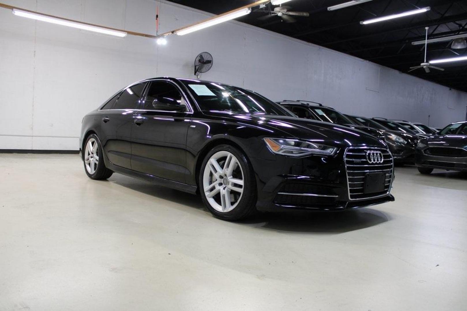 2016 Black Metallic /Brown Audi A6 2.0T Premium Plus (WAUGFAFC6GN) with an 2.0L 4-Cylinder TFSI engine, Automatic transmission, located at 15300 Midway Rd., Addison, TX, 75001, (972) 702-0011, 32.958321, -96.838074 - HOME OF THE NO HAGGLE PRICE - WHOLESALE PRICES TO THE PUBLIC!!<br><br>Black Metallic 2016 Audi A6 2.0T Premium Plus<br><br>22/32 City/Highway MPG<br><br>Awards:<br> * JD Power Automotive Performance, Execution and Layout (APEAL) Study<br><br>At Midway Auto Group, we strive to provide you with the b - Photo#1