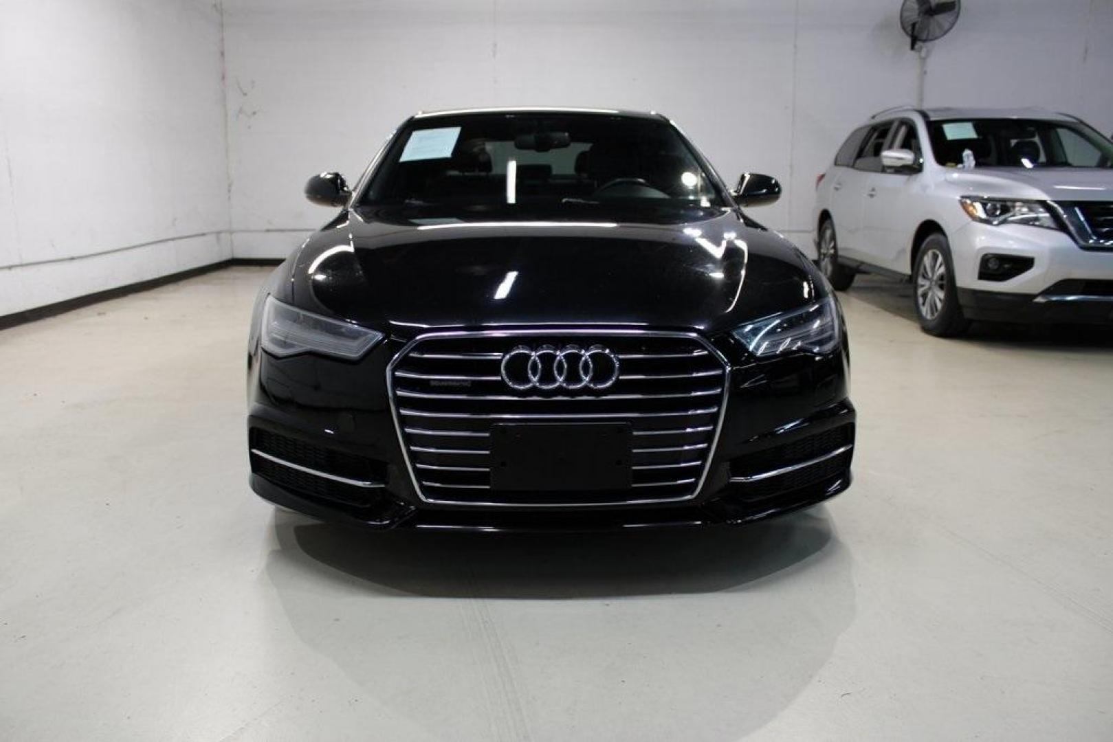 2016 Black Metallic /Brown Audi A6 2.0T Premium Plus (WAUGFAFC6GN) with an 2.0L 4-Cylinder TFSI engine, Automatic transmission, located at 15300 Midway Rd., Addison, TX, 75001, (972) 702-0011, 32.958321, -96.838074 - HOME OF THE NO HAGGLE PRICE - WHOLESALE PRICES TO THE PUBLIC!!<br><br>Black Metallic 2016 Audi A6 2.0T Premium Plus<br><br>22/32 City/Highway MPG<br><br>Awards:<br> * JD Power Automotive Performance, Execution and Layout (APEAL) Study<br><br>At Midway Auto Group, we strive to provide you with the b - Photo#5