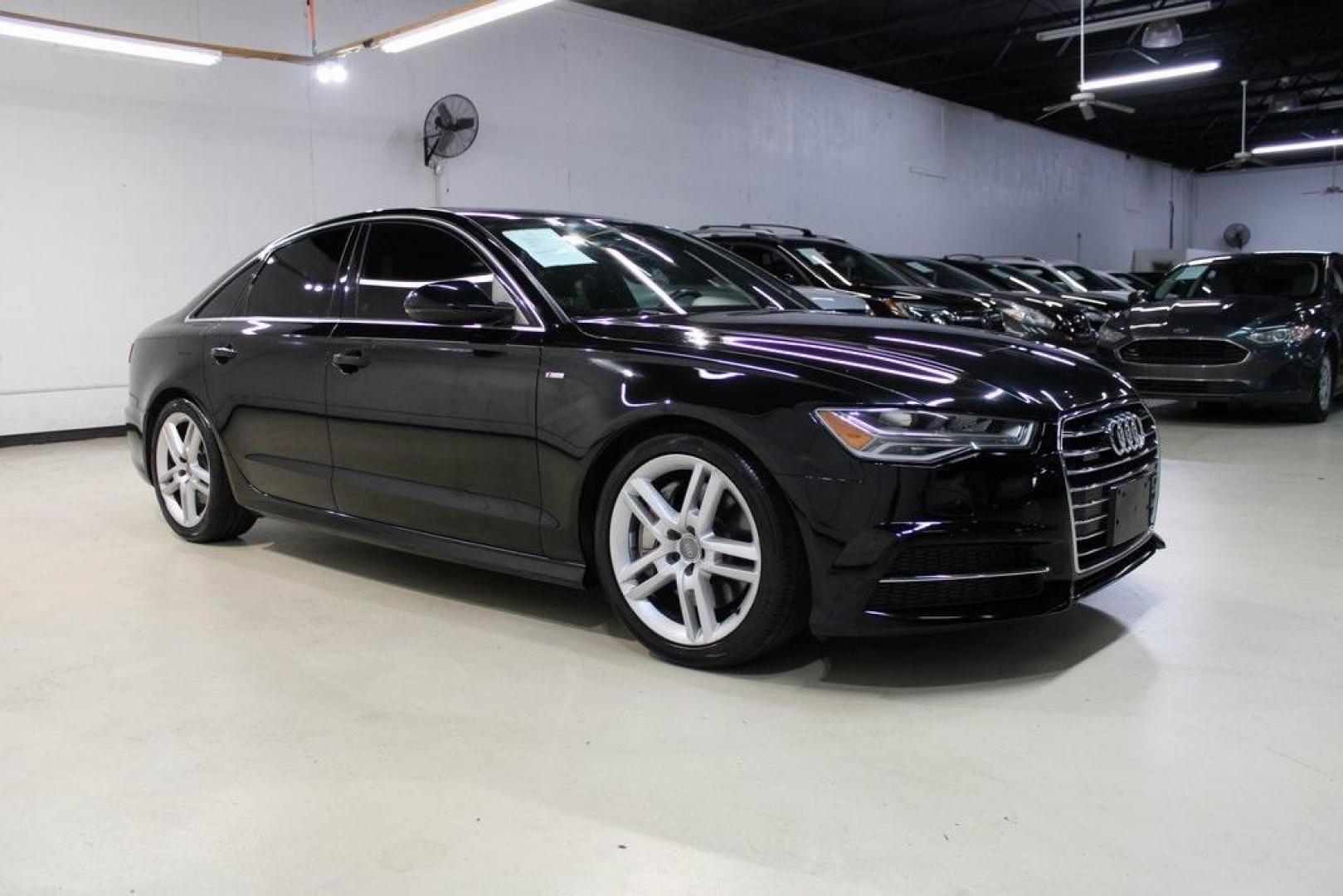 2016 Black Metallic /Brown Audi A6 2.0T Premium Plus (WAUGFAFC6GN) with an 2.0L 4-Cylinder TFSI engine, Automatic transmission, located at 15300 Midway Rd., Addison, TX, 75001, (972) 702-0011, 32.958321, -96.838074 - HOME OF THE NO HAGGLE PRICE - WHOLESALE PRICES TO THE PUBLIC!!<br><br>Black Metallic 2016 Audi A6 2.0T Premium Plus<br><br>22/32 City/Highway MPG<br><br>Awards:<br> * JD Power Automotive Performance, Execution and Layout (APEAL) Study<br><br>At Midway Auto Group, we strive to provide you with the b - Photo#6
