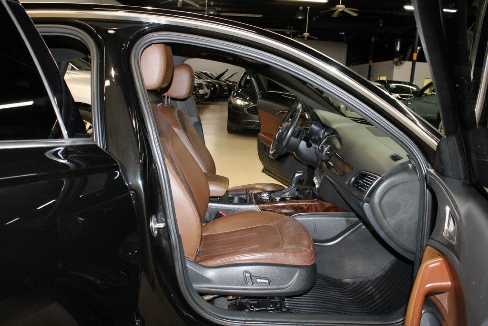 2016 Black Metallic /Brown Audi A6 2.0T Premium Plus (WAUGFAFC6GN) with an 2.0L 4-Cylinder TFSI engine, Automatic transmission, located at 15300 Midway Rd., Addison, TX, 75001, (972) 702-0011, 32.958321, -96.838074 - HOME OF THE NO HAGGLE PRICE - WHOLESALE PRICES TO THE PUBLIC!!<br><br>Black Metallic 2016 Audi A6 2.0T Premium Plus<br><br>22/32 City/Highway MPG<br><br>Awards:<br> * JD Power Automotive Performance, Execution and Layout (APEAL) Study<br><br>At Midway Auto Group, we strive to provide you with the b - Photo#15