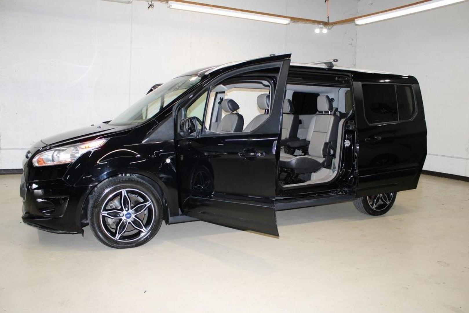 2017 Shadow Black /Medium Stone Ford Transit Connect Titanium (NM0GE9G76H1) with an Duratec 2.5L I4 engine, Automatic transmission, located at 15300 Midway Rd., Addison, TX, 75001, (972) 702-0011, 32.958321, -96.838074 - HOME OF THE NO HAGGLE PRICE - WHOLESALE PRICES TO THE PUBLIC!!<br><br>Shadow Black 2017 Ford Transit Connect Titanium<br><br>19/27 City/Highway MPG<br><br>Awards:<br> * 2017 KBB.com 10 Most Awarded Brands * 2017 KBB.com Brand Image Awards<br><br>At Midway Auto Group, we strive to provide you with - Photo#16