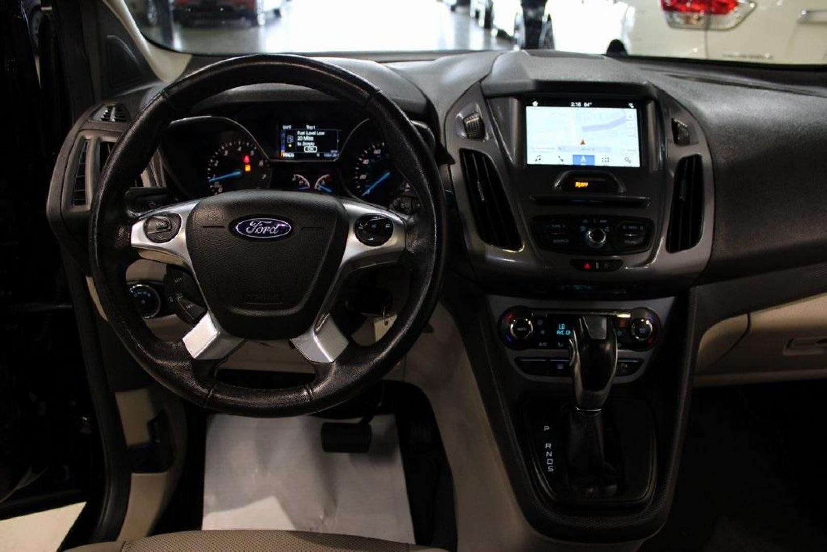 2017 Shadow Black /Medium Stone Ford Transit Connect Titanium (NM0GE9G76H1) with an Duratec 2.5L I4 engine, Automatic transmission, located at 15300 Midway Rd., Addison, TX, 75001, (972) 702-0011, 32.958321, -96.838074 - HOME OF THE NO HAGGLE PRICE - WHOLESALE PRICES TO THE PUBLIC!!<br><br>Shadow Black 2017 Ford Transit Connect Titanium<br><br>19/27 City/Highway MPG<br><br>Awards:<br> * 2017 KBB.com 10 Most Awarded Brands * 2017 KBB.com Brand Image Awards<br><br>At Midway Auto Group, we strive to provide you with - Photo#17