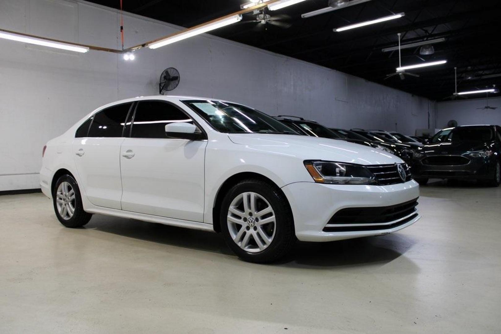 2017 White /Titan Black Volkswagen Jetta 1.4T S (3VW2B7AJ6HM) with an 1.4L TSI engine, Automatic transmission, located at 15300 Midway Rd., Addison, TX, 75001, (972) 702-0011, 32.958321, -96.838074 - HOME OF THE NO HAGGLE PRICE - WHOLESALE PRICES TO THE PUBLIC!!<br><br>White 2017 Volkswagen Jetta 1.4T S<br><br>28/38 City/Highway MPG<br><br>Awards:<br> * 2017 IIHS Top Safety Pick+ * 2017 KBB.com 10 Best Used Compact Cars Under $15,000 * 2017 KBB.com 10 Coolest New Cars Under $18,000<br><br>A - Photo#4
