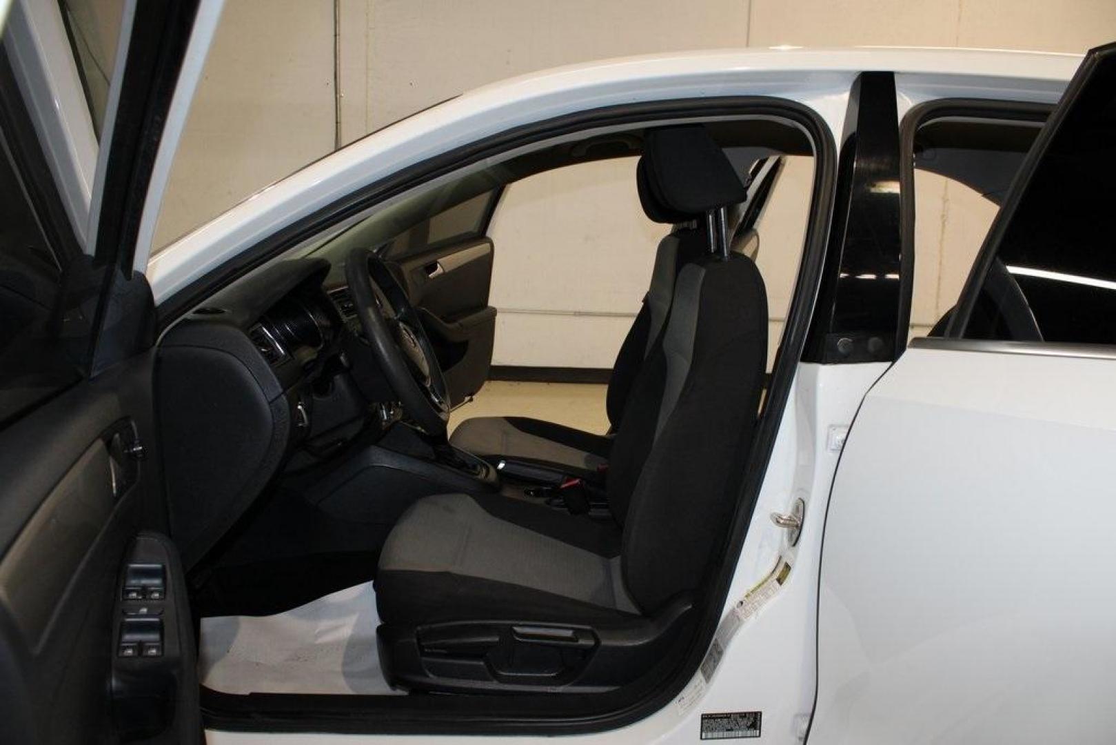 2017 White /Titan Black Volkswagen Jetta 1.4T S (3VW2B7AJ6HM) with an 1.4L TSI engine, Automatic transmission, located at 15300 Midway Rd., Addison, TX, 75001, (972) 702-0011, 32.958321, -96.838074 - HOME OF THE NO HAGGLE PRICE - WHOLESALE PRICES TO THE PUBLIC!!<br><br>White 2017 Volkswagen Jetta 1.4T S<br><br>28/38 City/Highway MPG<br><br>Awards:<br> * 2017 IIHS Top Safety Pick+ * 2017 KBB.com 10 Best Used Compact Cars Under $15,000 * 2017 KBB.com 10 Coolest New Cars Under $18,000<br><br>A - Photo#10