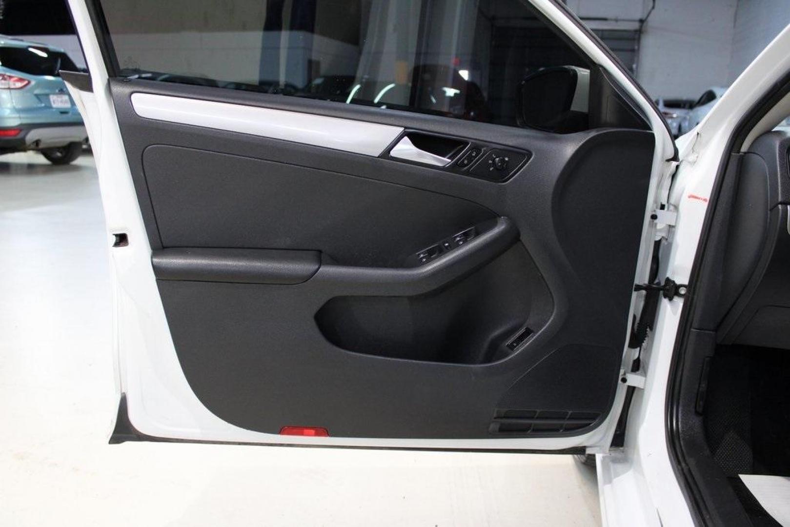 2017 White /Titan Black Volkswagen Jetta 1.4T S (3VW2B7AJ6HM) with an 1.4L TSI engine, Automatic transmission, located at 15300 Midway Rd., Addison, TX, 75001, (972) 702-0011, 32.958321, -96.838074 - HOME OF THE NO HAGGLE PRICE - WHOLESALE PRICES TO THE PUBLIC!!<br><br>White 2017 Volkswagen Jetta 1.4T S<br><br>28/38 City/Highway MPG<br><br>Awards:<br> * 2017 IIHS Top Safety Pick+ * 2017 KBB.com 10 Best Used Compact Cars Under $15,000 * 2017 KBB.com 10 Coolest New Cars Under $18,000<br><br>A - Photo#19