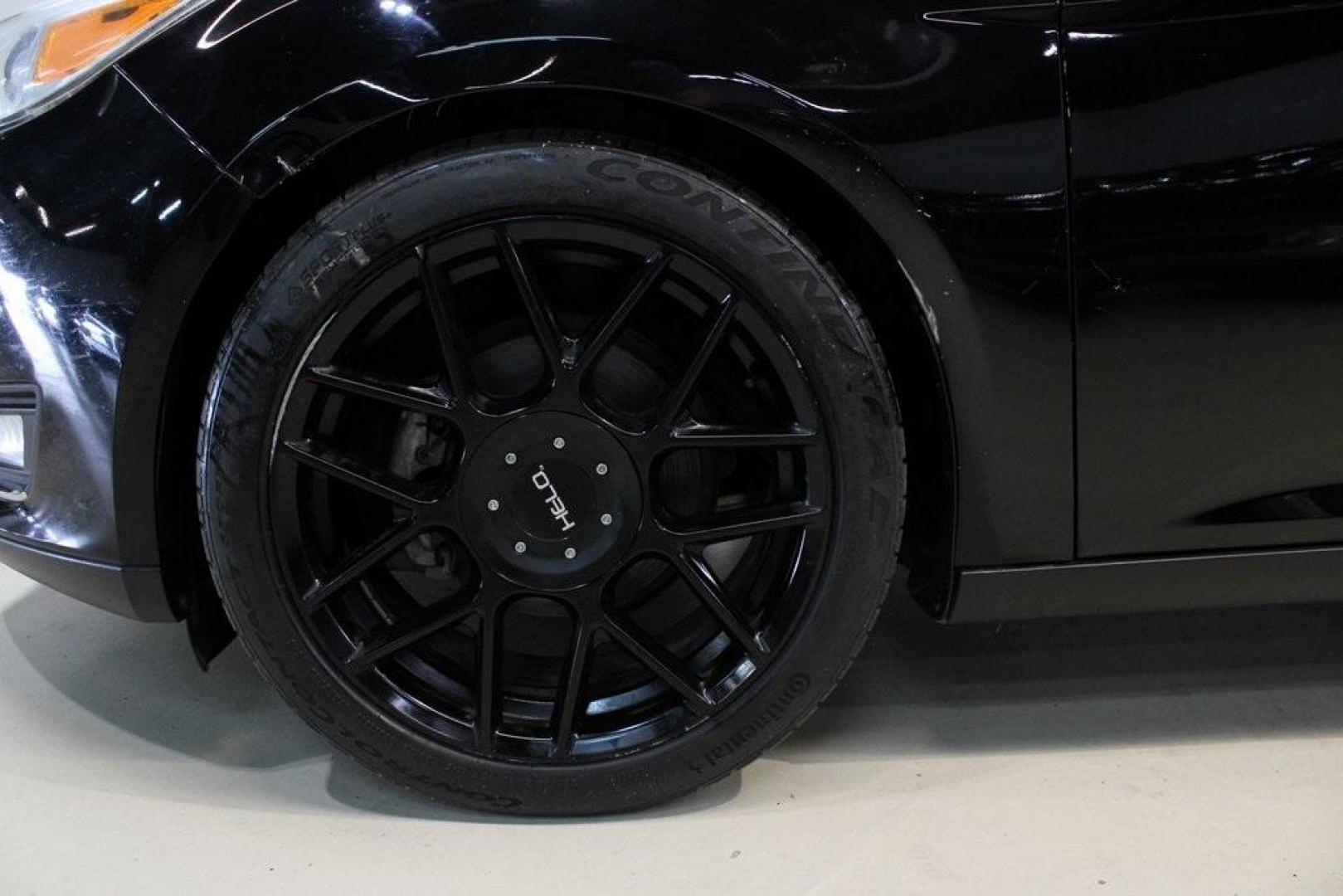 2018 Shadow Black /Medium Soft Ceramic Ford Focus Titanium (1FADP3N21JL) with an 2.0L I4 DGI Ti-VCT engine, Automatic transmission, located at 15300 Midway Rd., Addison, TX, 75001, (972) 702-0011, 32.958321, -96.838074 - HOME OF THE NO HAGGLE PRICE - WHOLESALE PRICES TO THE PUBLIC!!<br><br>Shadow Black 2018 Ford Focus Titanium<br><br>24/34 City/Highway MPG<br><br>Awards:<br> * 2018 KBB.com 10 Most Awarded Brands * 2018 KBB.com Brand Image Awards<br><br>At Midway Auto Group, we strive to provide you with the best - Photo#8