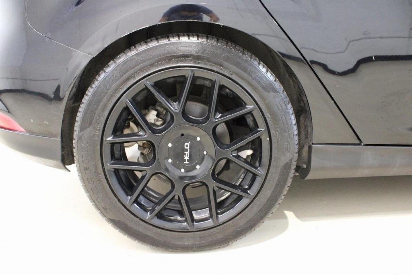 2018 Shadow Black /Medium Soft Ceramic Ford Focus Titanium (1FADP3N21JL) with an 2.0L I4 DGI Ti-VCT engine, Automatic transmission, located at 15300 Midway Rd., Addison, TX, 75001, (972) 702-0011, 32.958321, -96.838074 - HOME OF THE NO HAGGLE PRICE - WHOLESALE PRICES TO THE PUBLIC!!<br><br>Shadow Black 2018 Ford Focus Titanium<br><br>24/34 City/Highway MPG<br><br>Awards:<br> * 2018 KBB.com 10 Most Awarded Brands * 2018 KBB.com Brand Image Awards<br><br>At Midway Auto Group, we strive to provide you with the best - Photo#10
