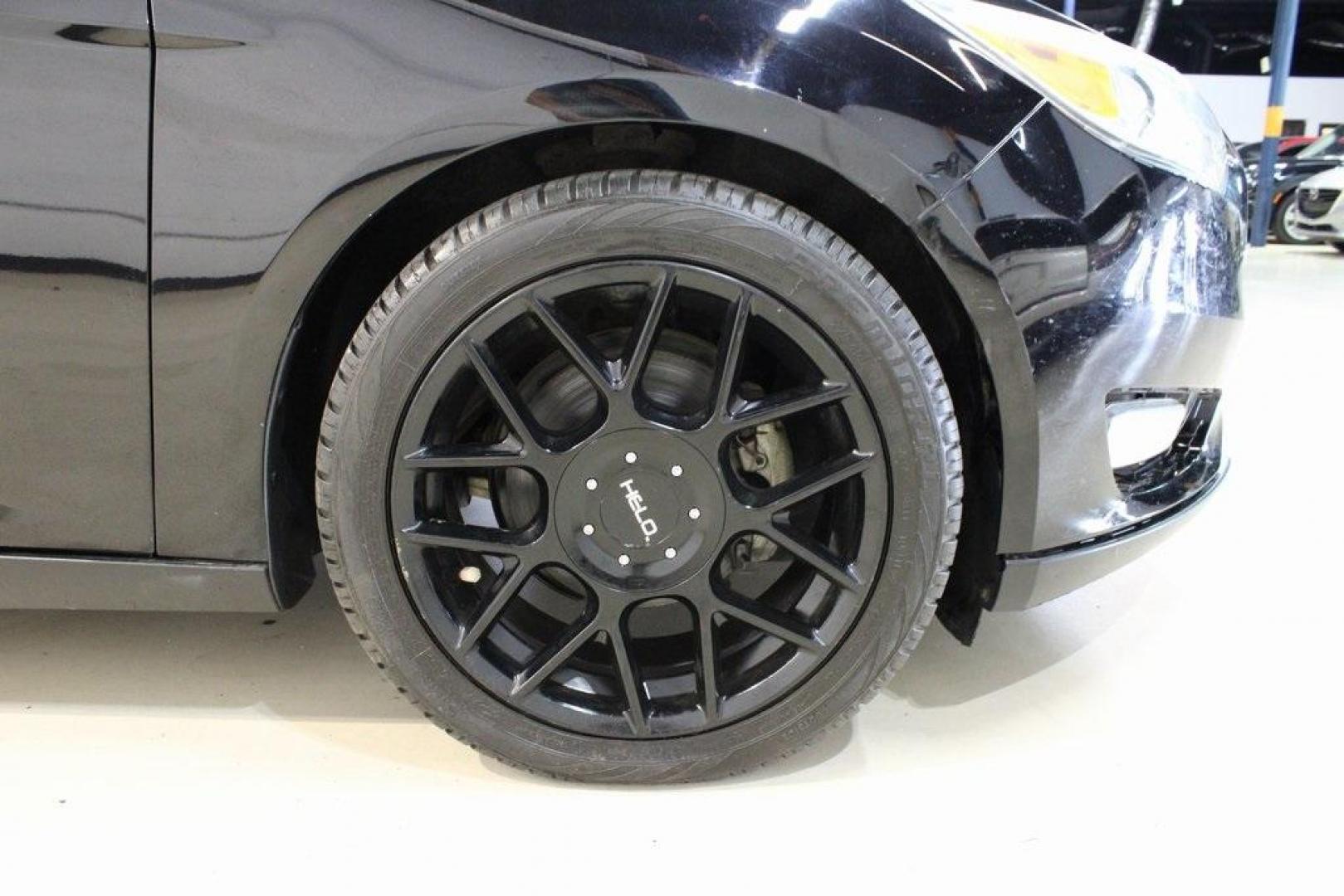 2018 Shadow Black /Medium Soft Ceramic Ford Focus Titanium (1FADP3N21JL) with an 2.0L I4 DGI Ti-VCT engine, Automatic transmission, located at 15300 Midway Rd., Addison, TX, 75001, (972) 702-0011, 32.958321, -96.838074 - HOME OF THE NO HAGGLE PRICE - WHOLESALE PRICES TO THE PUBLIC!!<br><br>Shadow Black 2018 Ford Focus Titanium<br><br>24/34 City/Highway MPG<br><br>Awards:<br> * 2018 KBB.com 10 Most Awarded Brands * 2018 KBB.com Brand Image Awards<br><br>At Midway Auto Group, we strive to provide you with the best - Photo#11