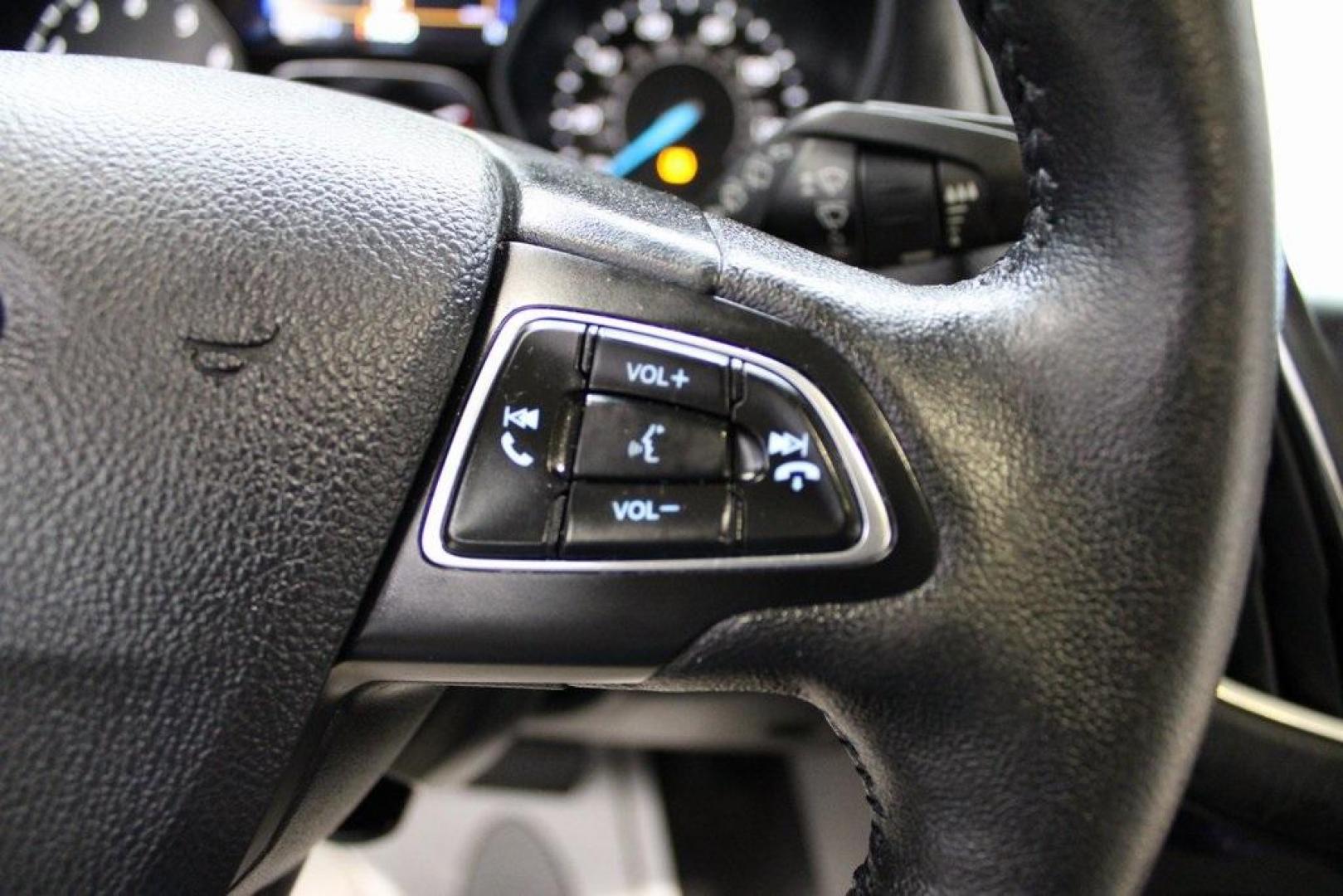 2018 Shadow Black /Medium Soft Ceramic Ford Focus Titanium (1FADP3N21JL) with an 2.0L I4 DGI Ti-VCT engine, Automatic transmission, located at 15300 Midway Rd., Addison, TX, 75001, (972) 702-0011, 32.958321, -96.838074 - HOME OF THE NO HAGGLE PRICE - WHOLESALE PRICES TO THE PUBLIC!!<br><br>Shadow Black 2018 Ford Focus Titanium<br><br>24/34 City/Highway MPG<br><br>Awards:<br> * 2018 KBB.com 10 Most Awarded Brands * 2018 KBB.com Brand Image Awards<br><br>At Midway Auto Group, we strive to provide you with the best - Photo#23