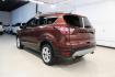 2018 Cinnamon Glaze /Charcoal Black Ford Escape SE (1FMCU0GD6JU) with an EcoBoost 2.0L I4 GTDi DOHC Turbocharged VCT engine, Automatic transmission, located at 15300 Midway Rd., Addison, TX, 75001, (972) 702-0011, 32.958321, -96.838074 - HOME OF THE NO HAGGLE PRICE - WHOLESALE PRICES TO THE PUBLIC!!<br><br>Cinnamon Glaze 2018 Ford Escape SE<br><br>23/30 City/Highway MPG<br><br>Awards:<br> * 2018 KBB.com 10 Most Awarded Brands * 2018 KBB.com Brand Image Awards<br><br>At Midway Auto Group, we strive to provide you with the best qua - Photo#3
