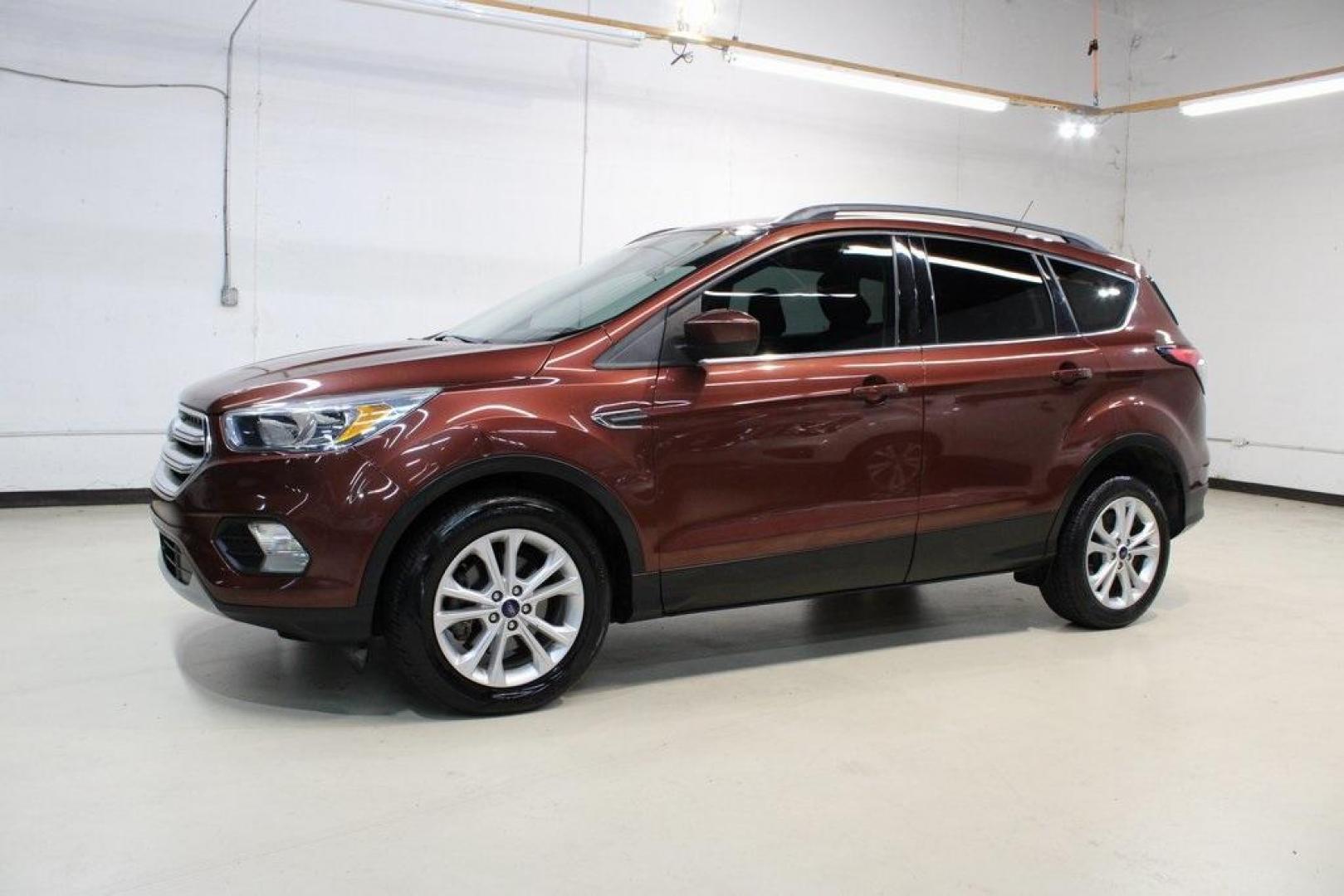 2018 Cinnamon Glaze /Charcoal Black Ford Escape SE (1FMCU0GD6JU) with an EcoBoost 2.0L I4 GTDi DOHC Turbocharged VCT engine, Automatic transmission, located at 15300 Midway Rd., Addison, TX, 75001, (972) 702-0011, 32.958321, -96.838074 - HOME OF THE NO HAGGLE PRICE - WHOLESALE PRICES TO THE PUBLIC!!<br><br>Cinnamon Glaze 2018 Ford Escape SE<br><br>23/30 City/Highway MPG<br><br>Awards:<br> * 2018 KBB.com 10 Most Awarded Brands * 2018 KBB.com Brand Image Awards<br><br>At Midway Auto Group, we strive to provide you with the best qua - Photo#4