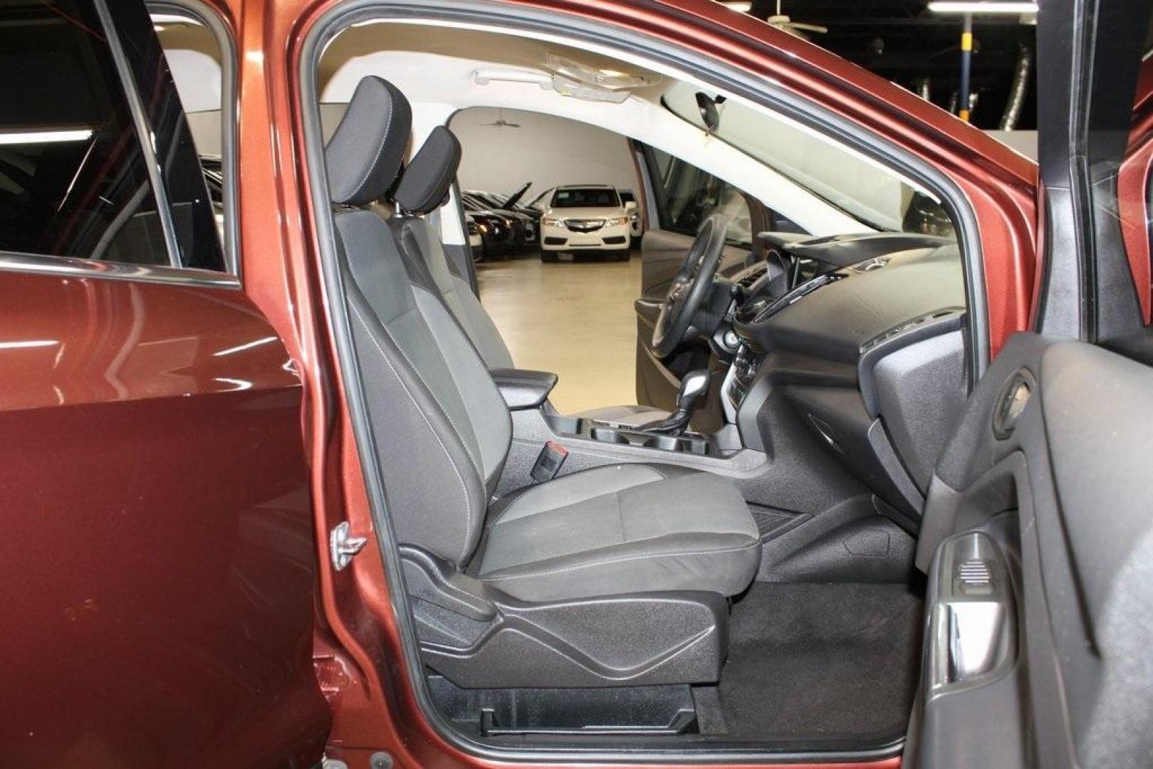 2018 Cinnamon Glaze /Charcoal Black Ford Escape SE (1FMCU0GD6JU) with an EcoBoost 2.0L I4 GTDi DOHC Turbocharged VCT engine, Automatic transmission, located at 15300 Midway Rd., Addison, TX, 75001, (972) 702-0011, 32.958321, -96.838074 - HOME OF THE NO HAGGLE PRICE - WHOLESALE PRICES TO THE PUBLIC!!<br><br>Cinnamon Glaze 2018 Ford Escape SE<br><br>23/30 City/Highway MPG<br><br>Awards:<br> * 2018 KBB.com 10 Most Awarded Brands * 2018 KBB.com Brand Image Awards<br><br>At Midway Auto Group, we strive to provide you with the best qua - Photo#14