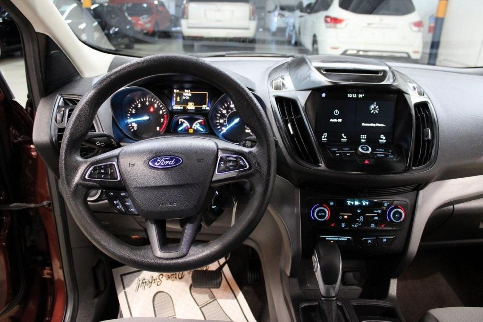 2018 Cinnamon Glaze /Charcoal Black Ford Escape SE (1FMCU0GD6JU) with an EcoBoost 2.0L I4 GTDi DOHC Turbocharged VCT engine, Automatic transmission, located at 15300 Midway Rd., Addison, TX, 75001, (972) 702-0011, 32.958321, -96.838074 - HOME OF THE NO HAGGLE PRICE - WHOLESALE PRICES TO THE PUBLIC!!<br><br>Cinnamon Glaze 2018 Ford Escape SE<br><br>23/30 City/Highway MPG<br><br>Awards:<br> * 2018 KBB.com 10 Most Awarded Brands * 2018 KBB.com Brand Image Awards<br><br>At Midway Auto Group, we strive to provide you with the best qua - Photo#17