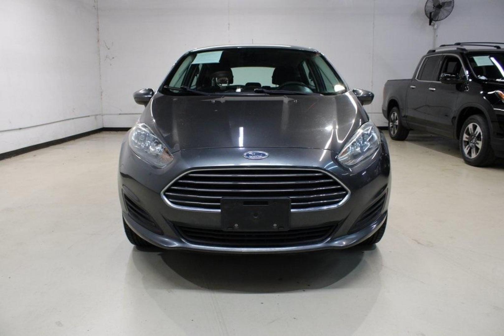 2019 Magnetic /Black Ford Fiesta SE (3FADP4EJ7KM) with an 1.6L I4 Ti-VCT engine, Automatic transmission, located at 15300 Midway Rd., Addison, TX, 75001, (972) 702-0011, 32.958321, -96.838074 - HOME OF THE NO HAGGLE PRICE - WHOLESALE PRICES TO THE PUBLIC!!<br><br>Magnetic 2019 Ford Fiesta SE<br><br>Recent Arrival! 27/37 City/Highway MPG<br><br><br>At Midway Auto Group, we strive to provide you with the best quality vehicles for the lowest possible price, and this 2019 Ford Fiesta is no exc - Photo#5
