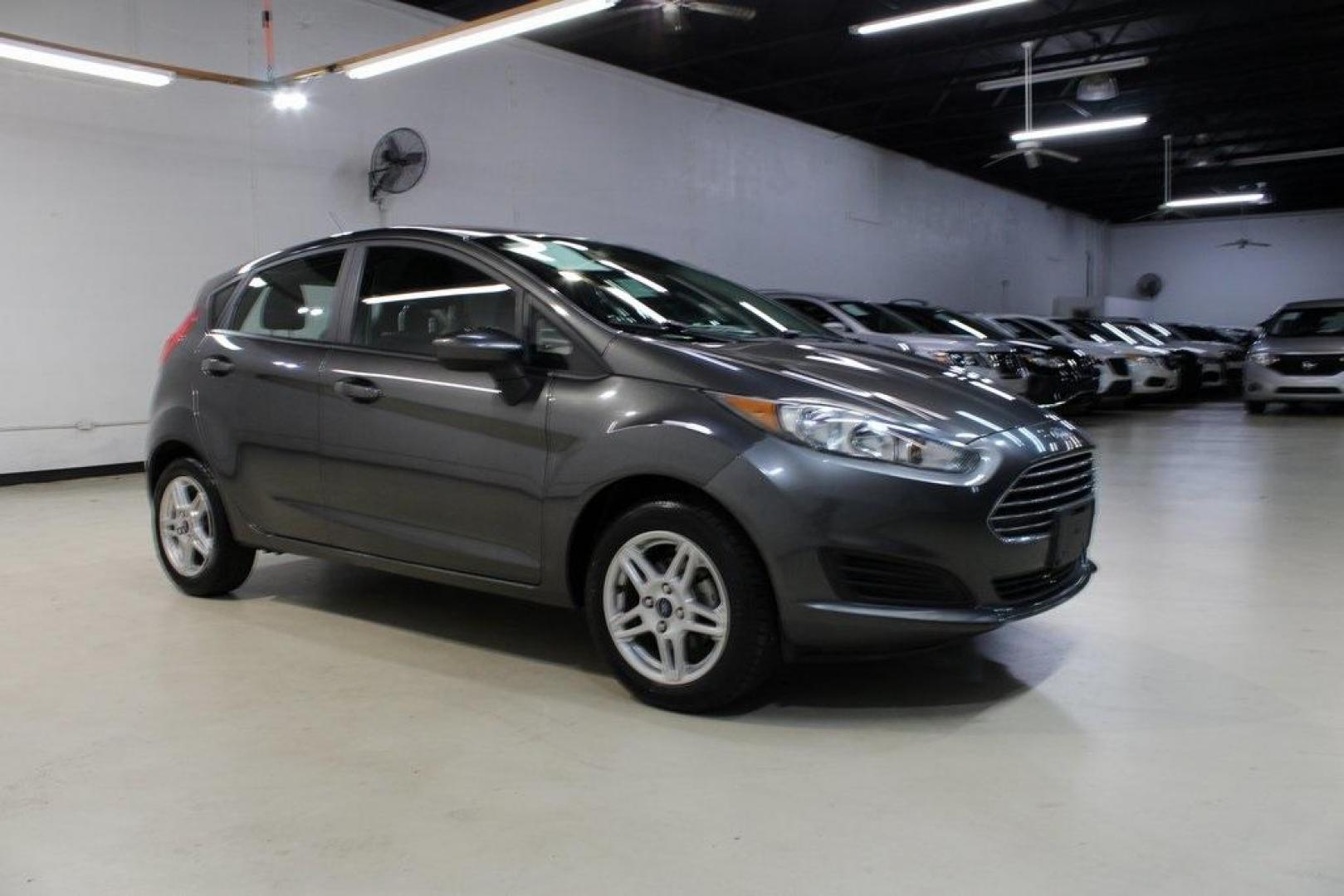 2019 Magnetic /Black Ford Fiesta SE (3FADP4EJ7KM) with an 1.6L I4 Ti-VCT engine, Automatic transmission, located at 15300 Midway Rd., Addison, TX, 75001, (972) 702-0011, 32.958321, -96.838074 - HOME OF THE NO HAGGLE PRICE - WHOLESALE PRICES TO THE PUBLIC!!<br><br>Magnetic 2019 Ford Fiesta SE<br><br>Recent Arrival! 27/37 City/Highway MPG<br><br><br>At Midway Auto Group, we strive to provide you with the best quality vehicles for the lowest possible price, and this 2019 Ford Fiesta is no exc - Photo#6