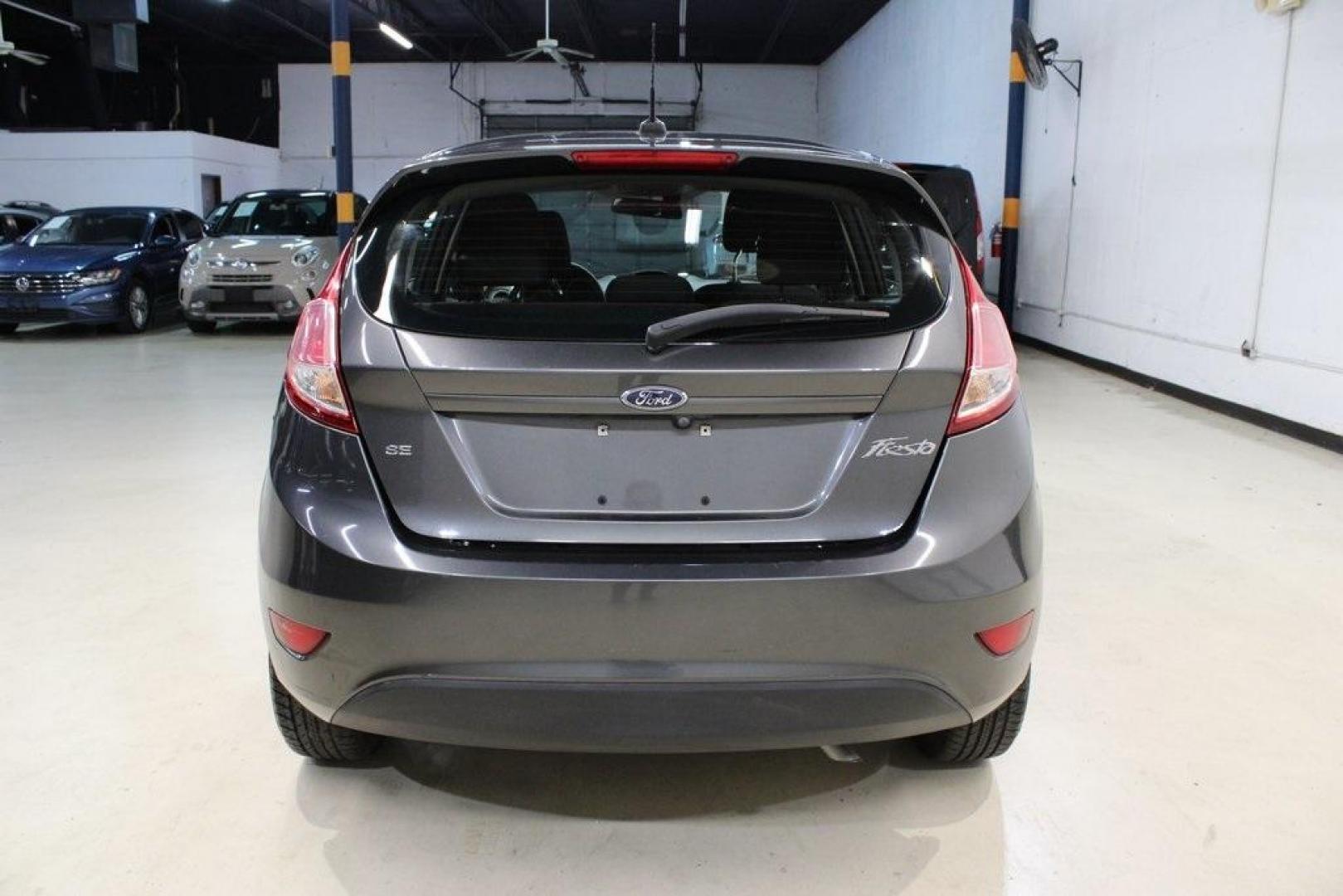 2019 Magnetic /Black Ford Fiesta SE (3FADP4EJ7KM) with an 1.6L I4 Ti-VCT engine, Automatic transmission, located at 15300 Midway Rd., Addison, TX, 75001, (972) 702-0011, 32.958321, -96.838074 - HOME OF THE NO HAGGLE PRICE - WHOLESALE PRICES TO THE PUBLIC!!<br><br>Magnetic 2019 Ford Fiesta SE<br><br>Recent Arrival! 27/37 City/Highway MPG<br><br><br>At Midway Auto Group, we strive to provide you with the best quality vehicles for the lowest possible price, and this 2019 Ford Fiesta is no exc - Photo#7