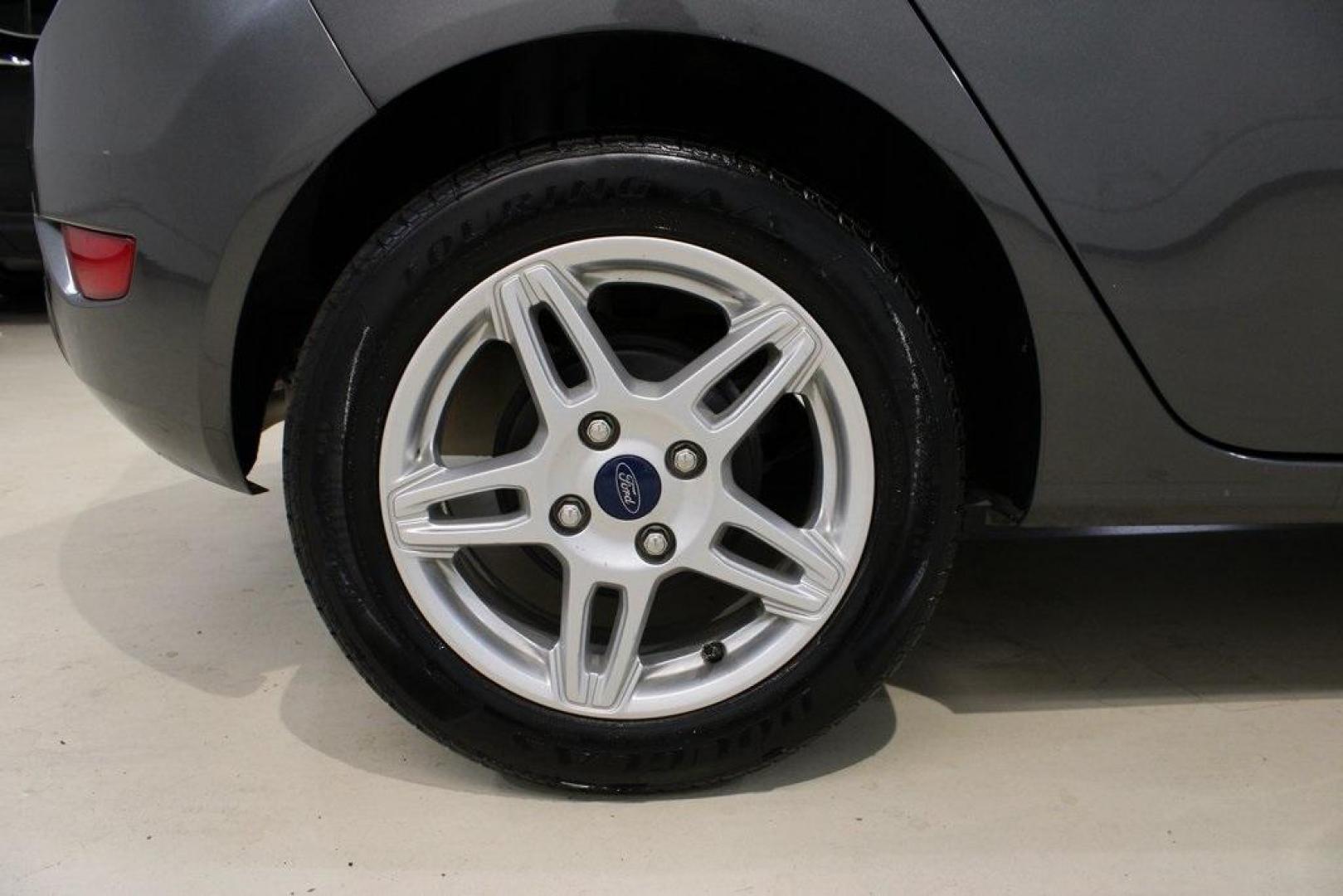 2019 Magnetic /Black Ford Fiesta SE (3FADP4EJ7KM) with an 1.6L I4 Ti-VCT engine, Automatic transmission, located at 15300 Midway Rd., Addison, TX, 75001, (972) 702-0011, 32.958321, -96.838074 - HOME OF THE NO HAGGLE PRICE - WHOLESALE PRICES TO THE PUBLIC!!<br><br>Magnetic 2019 Ford Fiesta SE<br><br>Recent Arrival! 27/37 City/Highway MPG<br><br><br>At Midway Auto Group, we strive to provide you with the best quality vehicles for the lowest possible price, and this 2019 Ford Fiesta is no exc - Photo#10