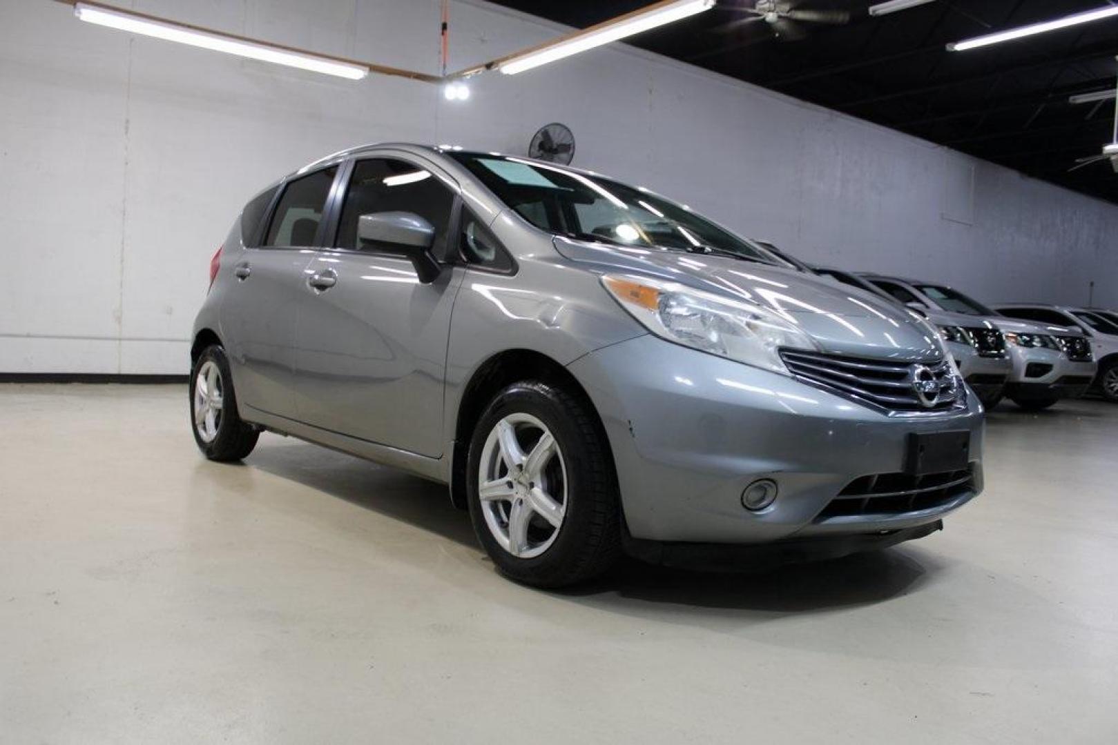 2015 Magnetic Gray Metallic /Charcoal Nissan Versa Note S (3N1CE2CP4FL) with an 1.6L 4-Cylinder DOHC 16V engine, Manual transmission, located at 15300 Midway Rd., Addison, TX, 75001, (972) 702-0011, 32.958321, -96.838074 - HOME OF THE NO HAGGLE PRICE - WHOLESALE PRICES TO THE PUBLIC!! Priced below KBB Fair Purchase Price!<br><br>Magnetic Gray Metallic 2015 Nissan Versa Note S<br><br>27/36 City/Highway MPG<br><br><br>At Midway Auto Group, we strive to provide you with the best quality vehicles for the lowest possible p - Photo#2