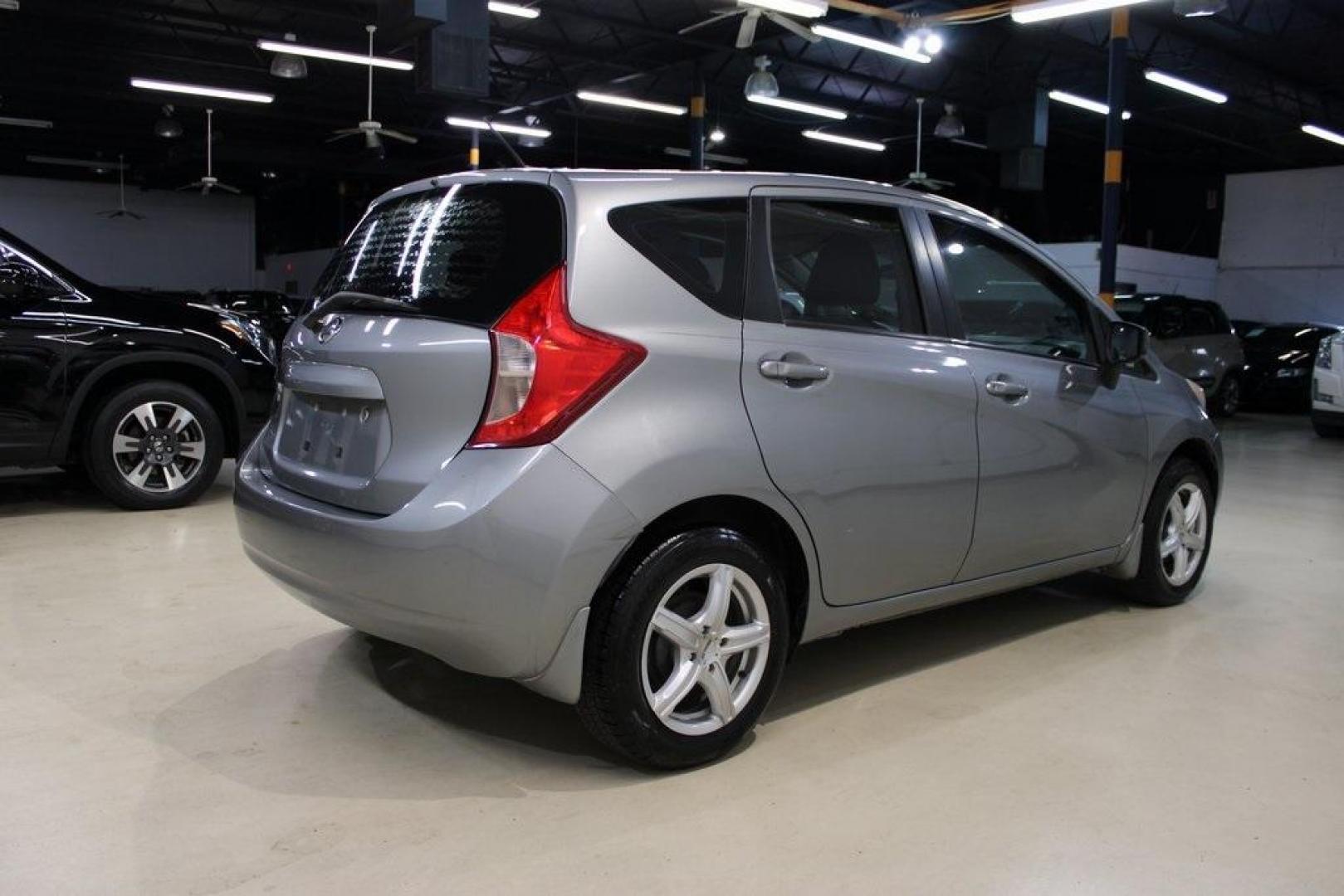 2015 Magnetic Gray Metallic /Charcoal Nissan Versa Note S (3N1CE2CP4FL) with an 1.6L 4-Cylinder DOHC 16V engine, Manual transmission, located at 15300 Midway Rd., Addison, TX, 75001, (972) 702-0011, 32.958321, -96.838074 - HOME OF THE NO HAGGLE PRICE - WHOLESALE PRICES TO THE PUBLIC!! Priced below KBB Fair Purchase Price!<br><br>Magnetic Gray Metallic 2015 Nissan Versa Note S<br><br>27/36 City/Highway MPG<br><br><br>At Midway Auto Group, we strive to provide you with the best quality vehicles for the lowest possible p - Photo#3