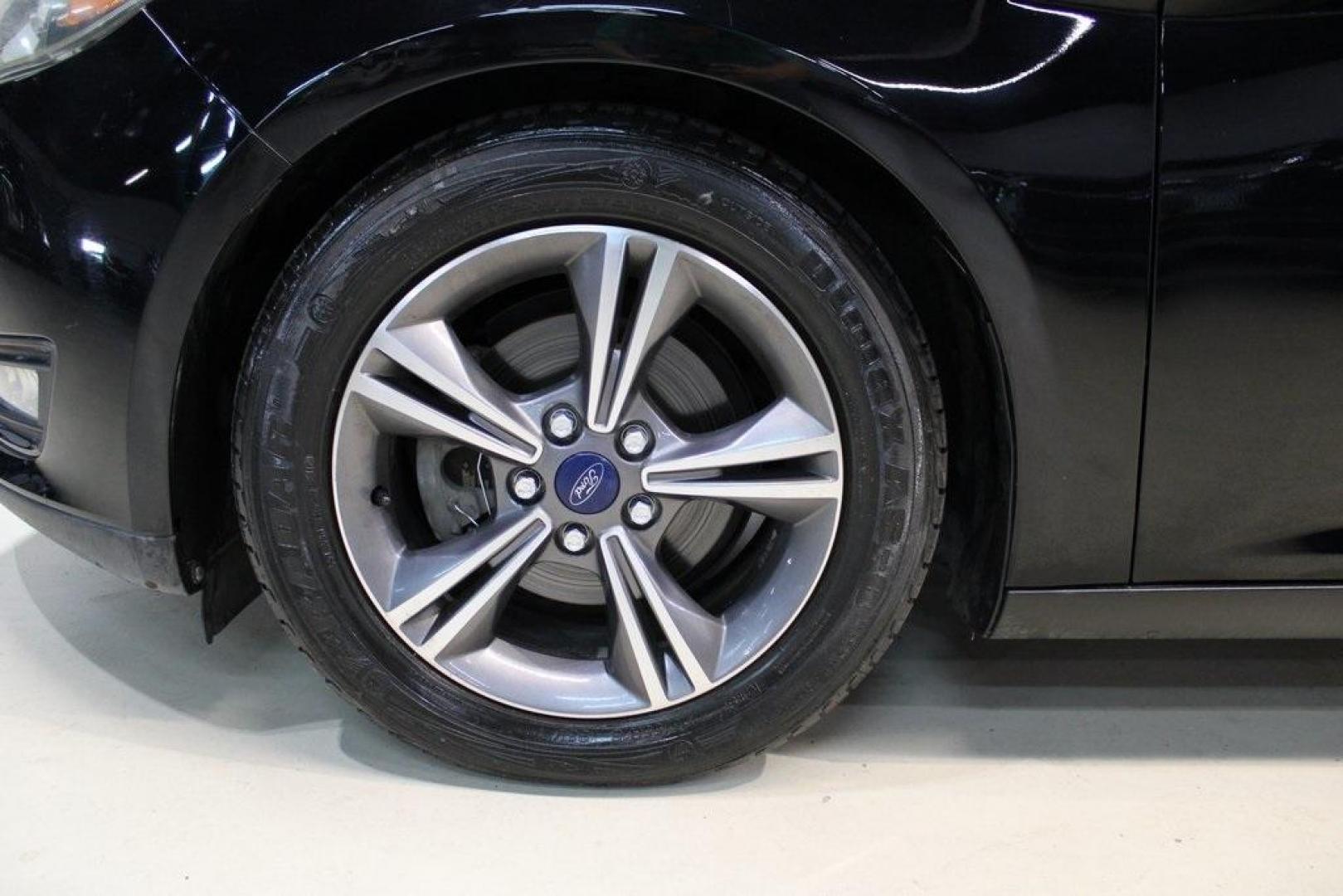 2017 Shadow Black /Charcoal Black Ford Focus SE (1FADP3FE8HL) with an EcoBoost 1.0L I3 GTDi DOHC Turbocharged VCT engine, Automatic transmission, located at 15300 Midway Rd., Addison, TX, 75001, (972) 702-0011, 32.958321, -96.838074 - HOME OF THE NO HAGGLE PRICE - WHOLESALE PRICES TO THE PUBLIC!!<br><br>Shadow Black 2017 Ford Focus SE<br><br>Recent Arrival! 27/38 City/Highway MPG<br><br>Awards:<br> * 2017 KBB.com 10 Most Awarded Brands * 2017 KBB.com Brand Image Awards<br><br>At Midway Auto Group, we strive to provide you with - Photo#8