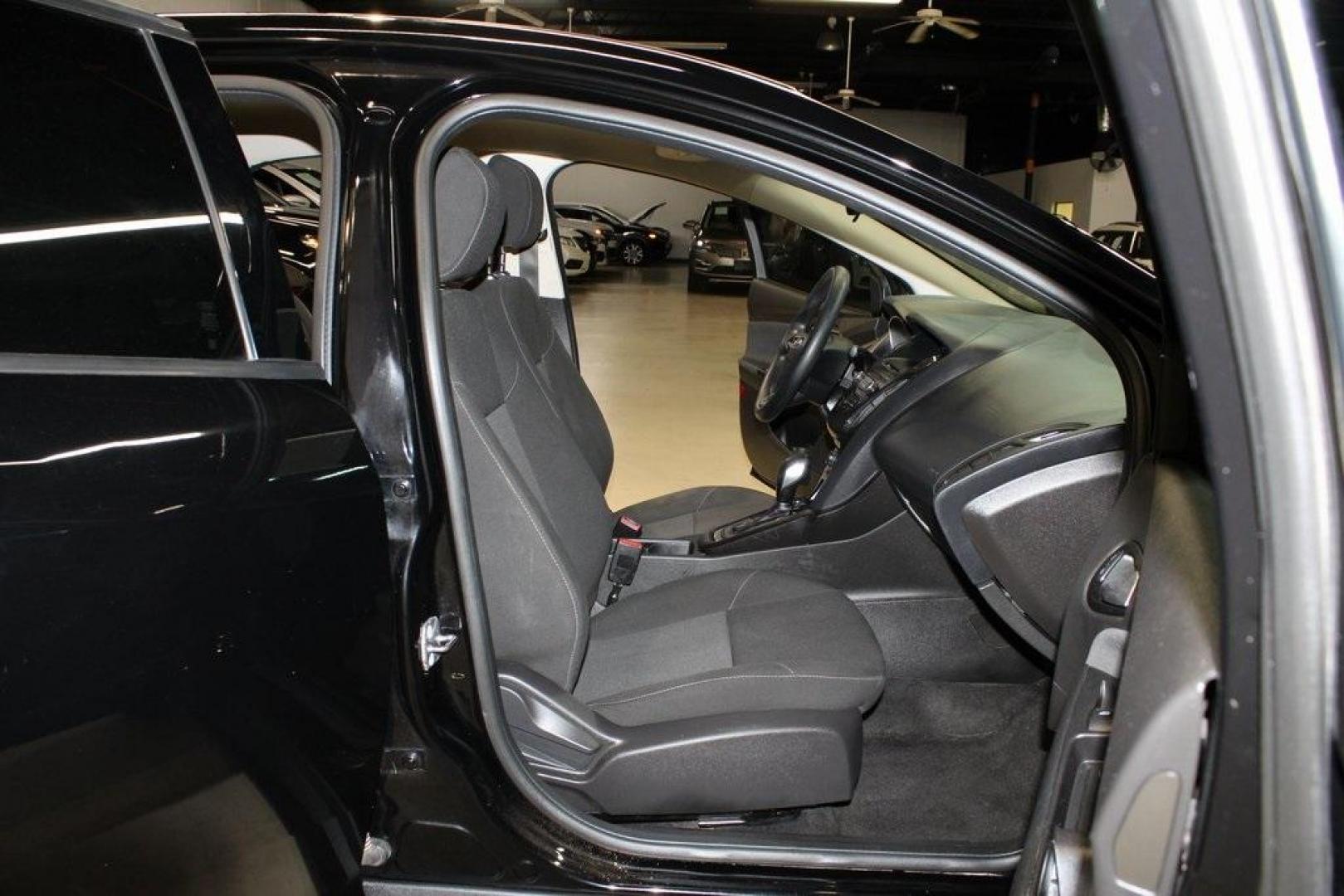 2017 Shadow Black /Charcoal Black Ford Focus SE (1FADP3FE8HL) with an EcoBoost 1.0L I3 GTDi DOHC Turbocharged VCT engine, Automatic transmission, located at 15300 Midway Rd., Addison, TX, 75001, (972) 702-0011, 32.958321, -96.838074 - HOME OF THE NO HAGGLE PRICE - WHOLESALE PRICES TO THE PUBLIC!!<br><br>Shadow Black 2017 Ford Focus SE<br><br>Recent Arrival! 27/38 City/Highway MPG<br><br>Awards:<br> * 2017 KBB.com 10 Most Awarded Brands * 2017 KBB.com Brand Image Awards<br><br>At Midway Auto Group, we strive to provide you with - Photo#13