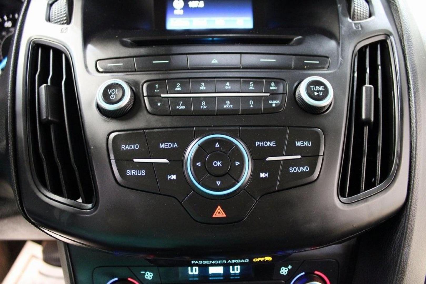 2017 Shadow Black /Charcoal Black Ford Focus SE (1FADP3FE8HL) with an EcoBoost 1.0L I3 GTDi DOHC Turbocharged VCT engine, Automatic transmission, located at 15300 Midway Rd., Addison, TX, 75001, (972) 702-0011, 32.958321, -96.838074 - HOME OF THE NO HAGGLE PRICE - WHOLESALE PRICES TO THE PUBLIC!!<br><br>Shadow Black 2017 Ford Focus SE<br><br>Recent Arrival! 27/38 City/Highway MPG<br><br>Awards:<br> * 2017 KBB.com 10 Most Awarded Brands * 2017 KBB.com Brand Image Awards<br><br>At Midway Auto Group, we strive to provide you with - Photo#19