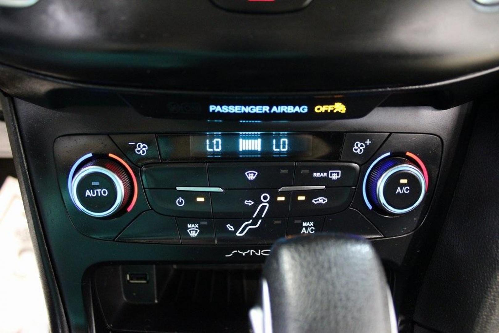 2017 Shadow Black /Charcoal Black Ford Focus SE (1FADP3FE8HL) with an EcoBoost 1.0L I3 GTDi DOHC Turbocharged VCT engine, Automatic transmission, located at 15300 Midway Rd., Addison, TX, 75001, (972) 702-0011, 32.958321, -96.838074 - HOME OF THE NO HAGGLE PRICE - WHOLESALE PRICES TO THE PUBLIC!!<br><br>Shadow Black 2017 Ford Focus SE<br><br>Recent Arrival! 27/38 City/Highway MPG<br><br>Awards:<br> * 2017 KBB.com 10 Most Awarded Brands * 2017 KBB.com Brand Image Awards<br><br>At Midway Auto Group, we strive to provide you with - Photo#20