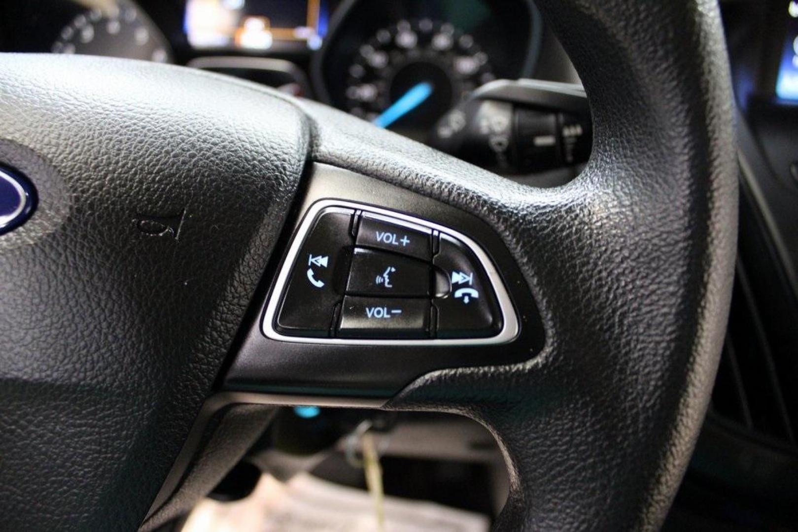 2017 Shadow Black /Charcoal Black Ford Focus SE (1FADP3FE8HL) with an EcoBoost 1.0L I3 GTDi DOHC Turbocharged VCT engine, Automatic transmission, located at 15300 Midway Rd., Addison, TX, 75001, (972) 702-0011, 32.958321, -96.838074 - HOME OF THE NO HAGGLE PRICE - WHOLESALE PRICES TO THE PUBLIC!!<br><br>Shadow Black 2017 Ford Focus SE<br><br>Recent Arrival! 27/38 City/Highway MPG<br><br>Awards:<br> * 2017 KBB.com 10 Most Awarded Brands * 2017 KBB.com Brand Image Awards<br><br>At Midway Auto Group, we strive to provide you with - Photo#23