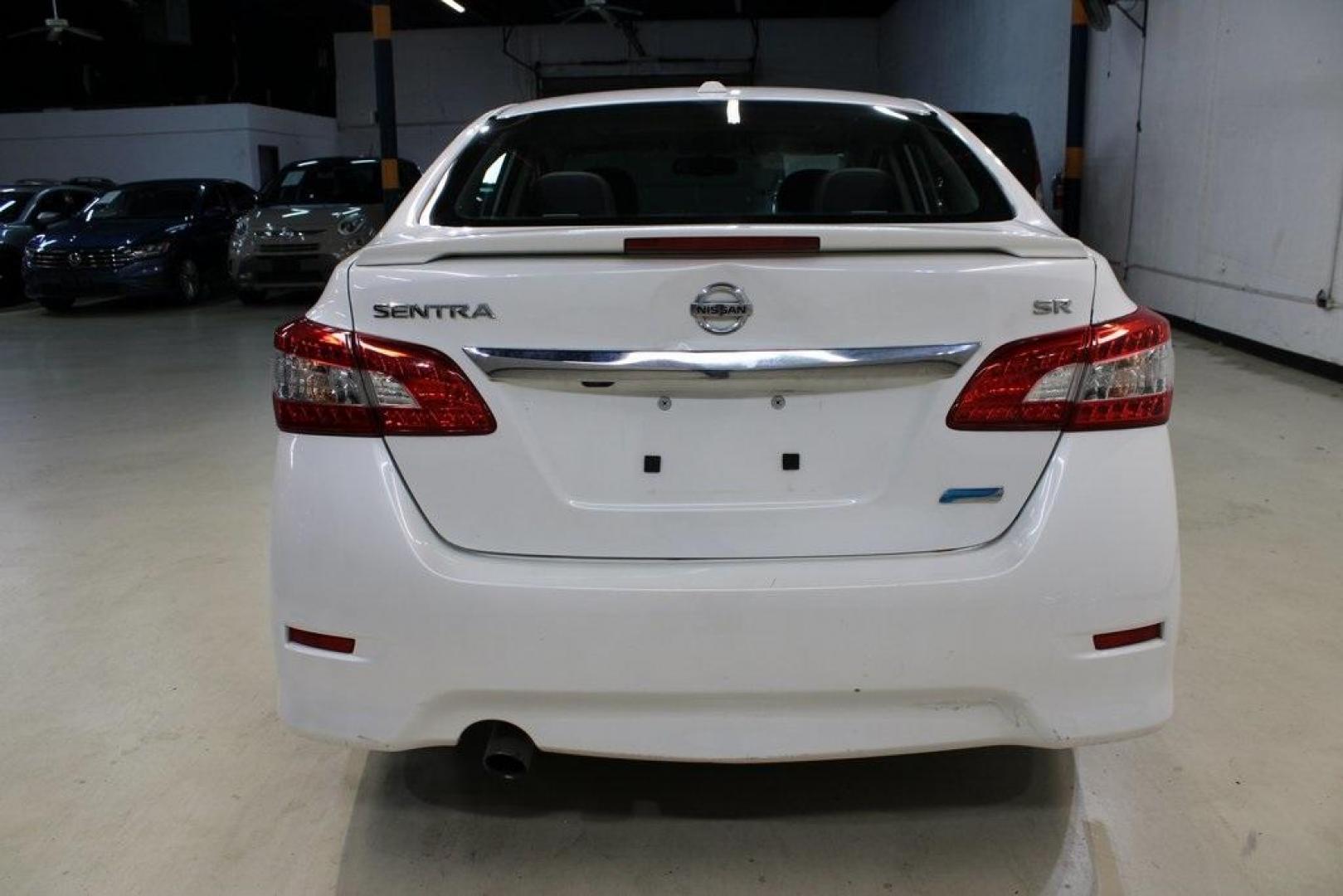 2014 Aspen White /Charcoal Nissan Sentra SR (3N1AB7AP6EY) with an 1.8L 4-Cylinder DOHC 16V engine, CVT transmission, located at 15300 Midway Rd., Addison, TX, 75001, (972) 702-0011, 32.958321, -96.838074 - HOME OF THE NO HAGGLE PRICE - WHOLESALE PRICES TO THE PUBLIC!!<br><br>Aspen White 2014 Nissan Sentra SR<br><br>30/39 City/Highway MPG<br><br>Awards:<br> * 2014 KBB.com 10 Best Used Compact Cars Under $10,000<br><br>At Midway Auto Group, we strive to provide you with the best quality vehicles for th - Photo#4