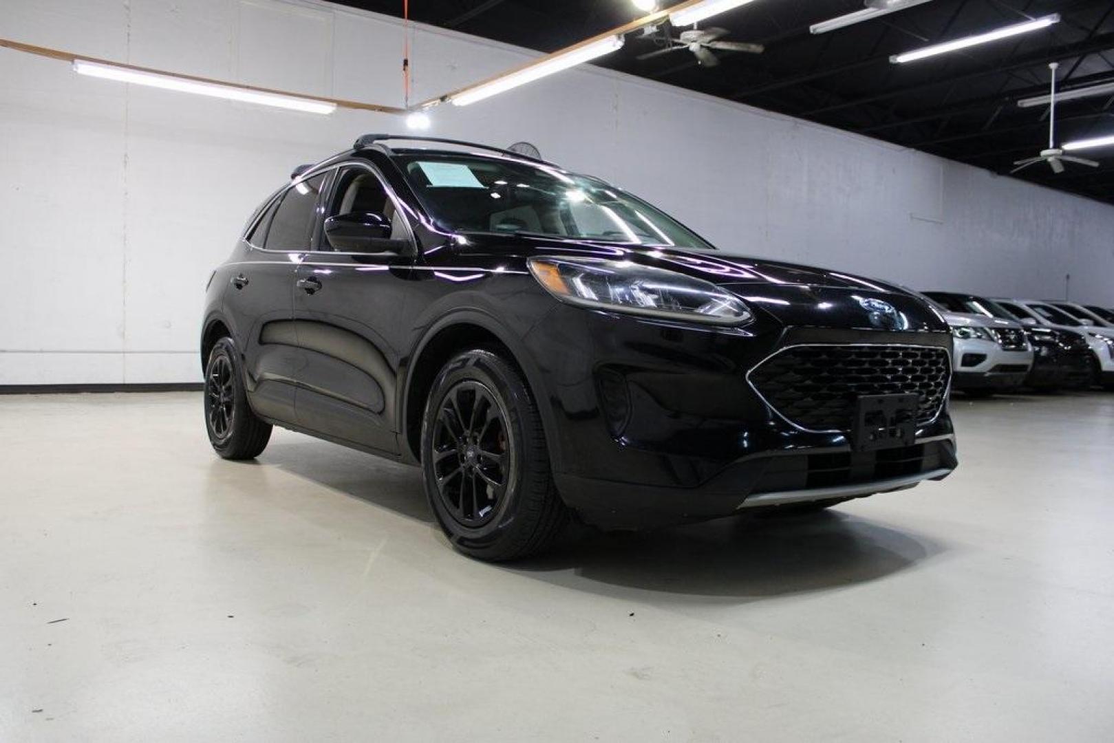 2020 Black /Sandstone Ford Escape SE (1FMCU0G61LU) with an 1.5L EcoBoost engine, Automatic transmission, located at 15300 Midway Rd., Addison, TX, 75001, (972) 702-0011, 32.958321, -96.838074 - Photo#1