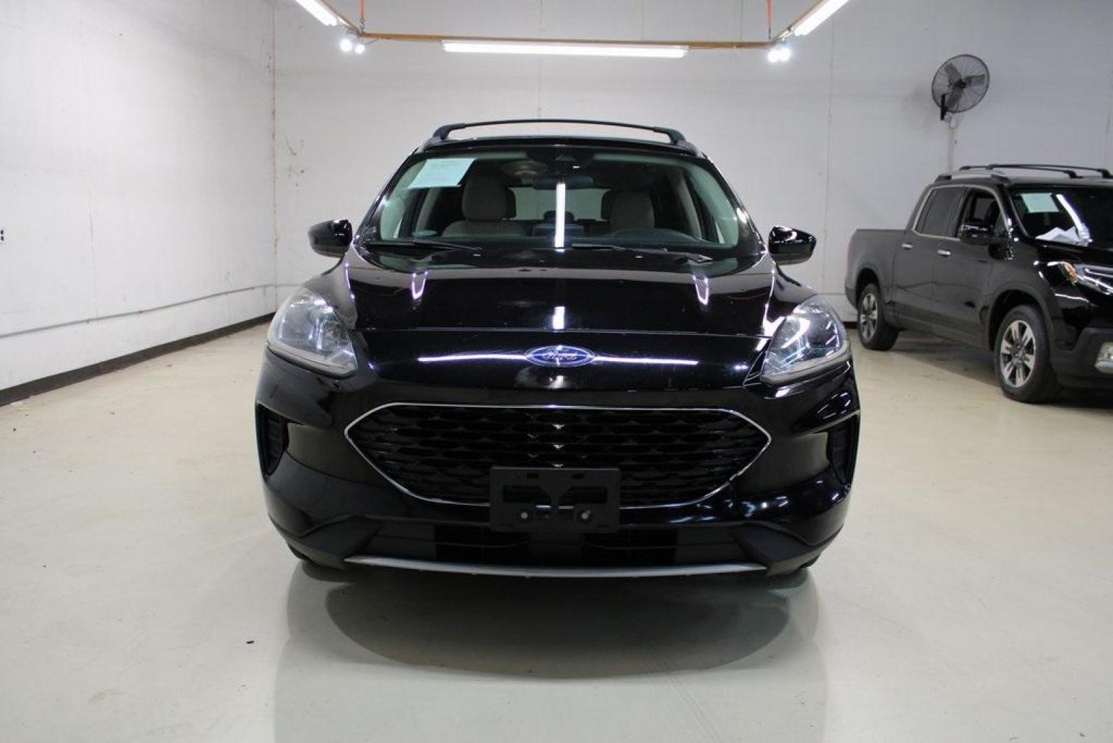 2020 Black /Sandstone Ford Escape SE (1FMCU0G61LU) with an 1.5L EcoBoost engine, Automatic transmission, located at 15300 Midway Rd., Addison, TX, 75001, (972) 702-0011, 32.958321, -96.838074 - Photo#5