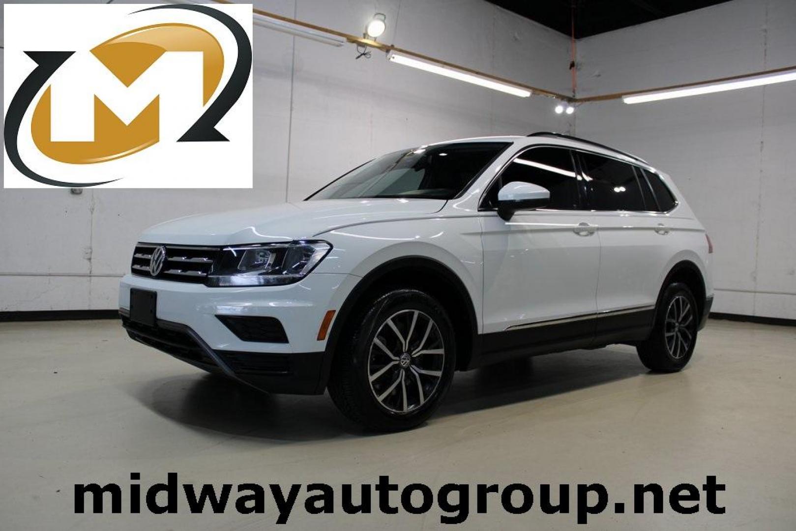 2018 Pure White /Golden Oak and Black Volkswagen Tiguan 2.0T SE (3VV3B7AX1JM) with an 2.0L TSI DOHC engine, Automatic transmission, located at 15300 Midway Rd., Addison, TX, 75001, (972) 702-0011, 32.958321, -96.838074 - Photo#0