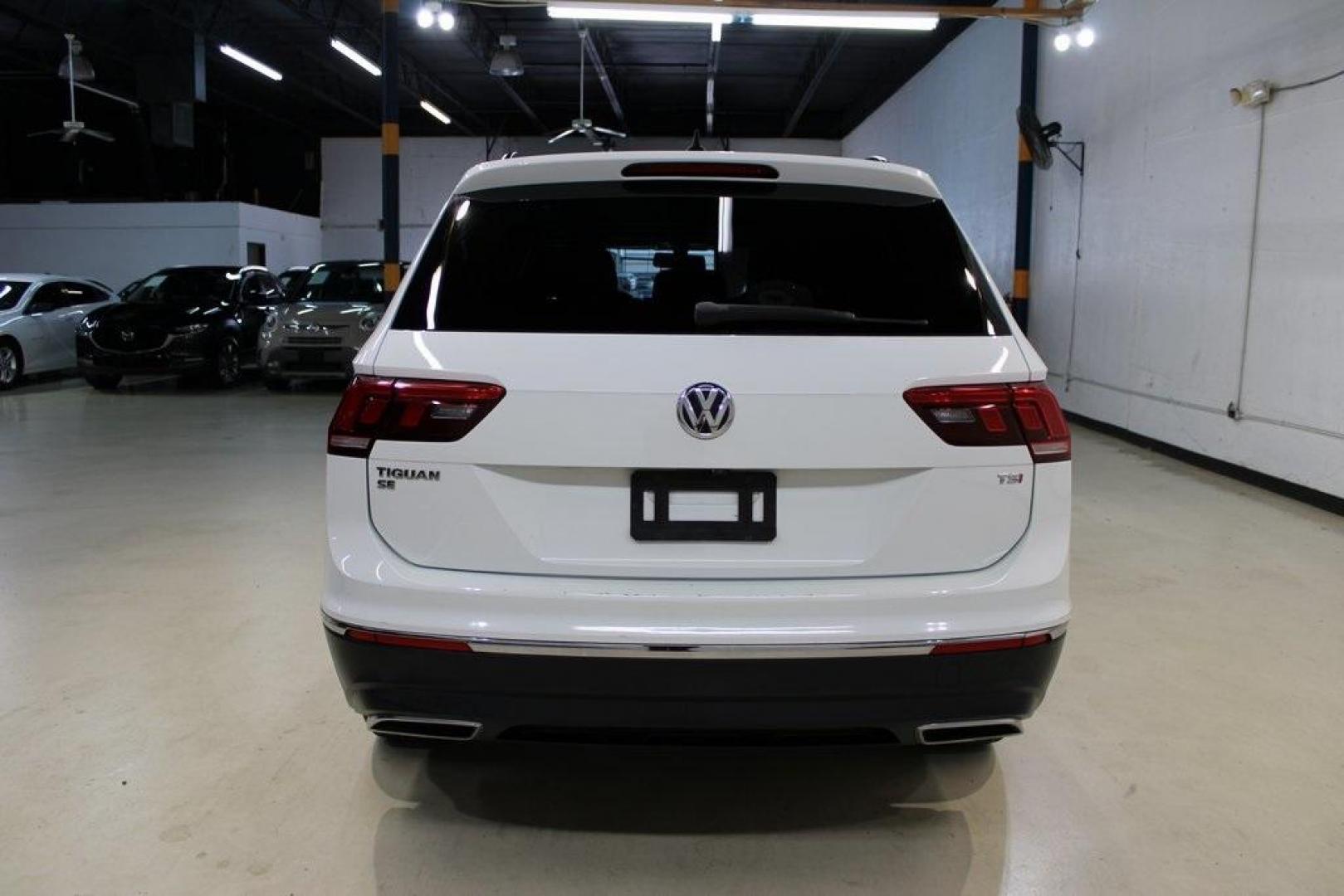 2018 Pure White /Golden Oak and Black Volkswagen Tiguan 2.0T SE (3VV3B7AX1JM) with an 2.0L TSI DOHC engine, Automatic transmission, located at 15300 Midway Rd., Addison, TX, 75001, (972) 702-0011, 32.958321, -96.838074 - Photo#7