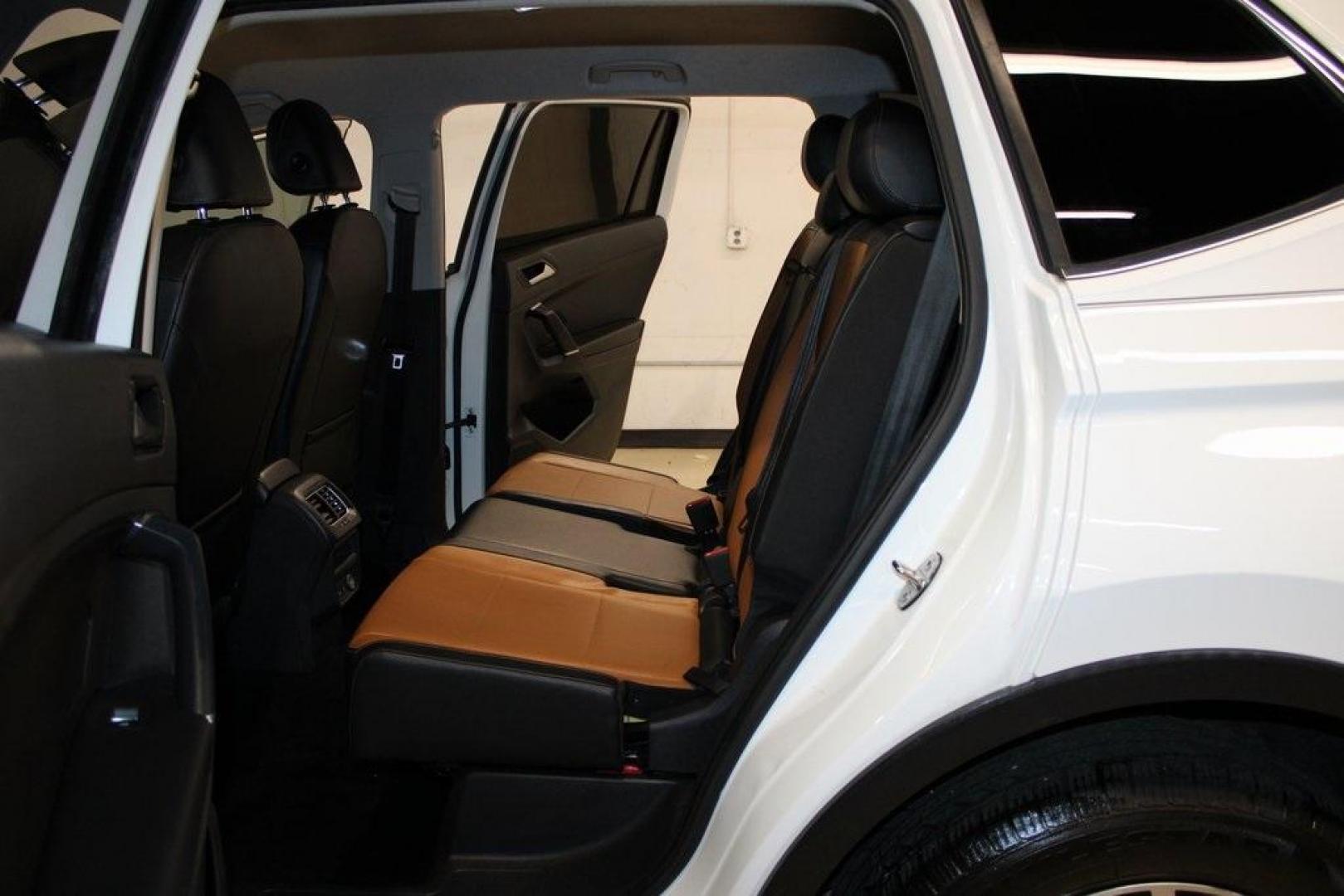 2018 Pure White /Golden Oak and Black Volkswagen Tiguan 2.0T SE (3VV3B7AX1JM) with an 2.0L TSI DOHC engine, Automatic transmission, located at 15300 Midway Rd., Addison, TX, 75001, (972) 702-0011, 32.958321, -96.838074 - Photo#16