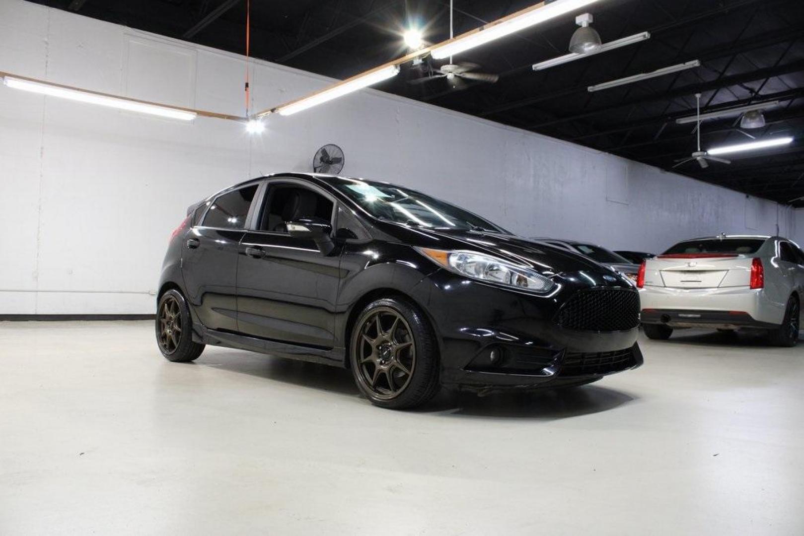 2017 Shadow Black /Smoke Storm Ford Fiesta ST (3FADP4GX7HM) with an EcoBoost 1.6L I4 GTDi DOHC Turbocharged VCT engine, Manual transmission, located at 15300 Midway Rd., Addison, TX, 75001, (972) 702-0011, 32.958321, -96.838074 - Photo#1