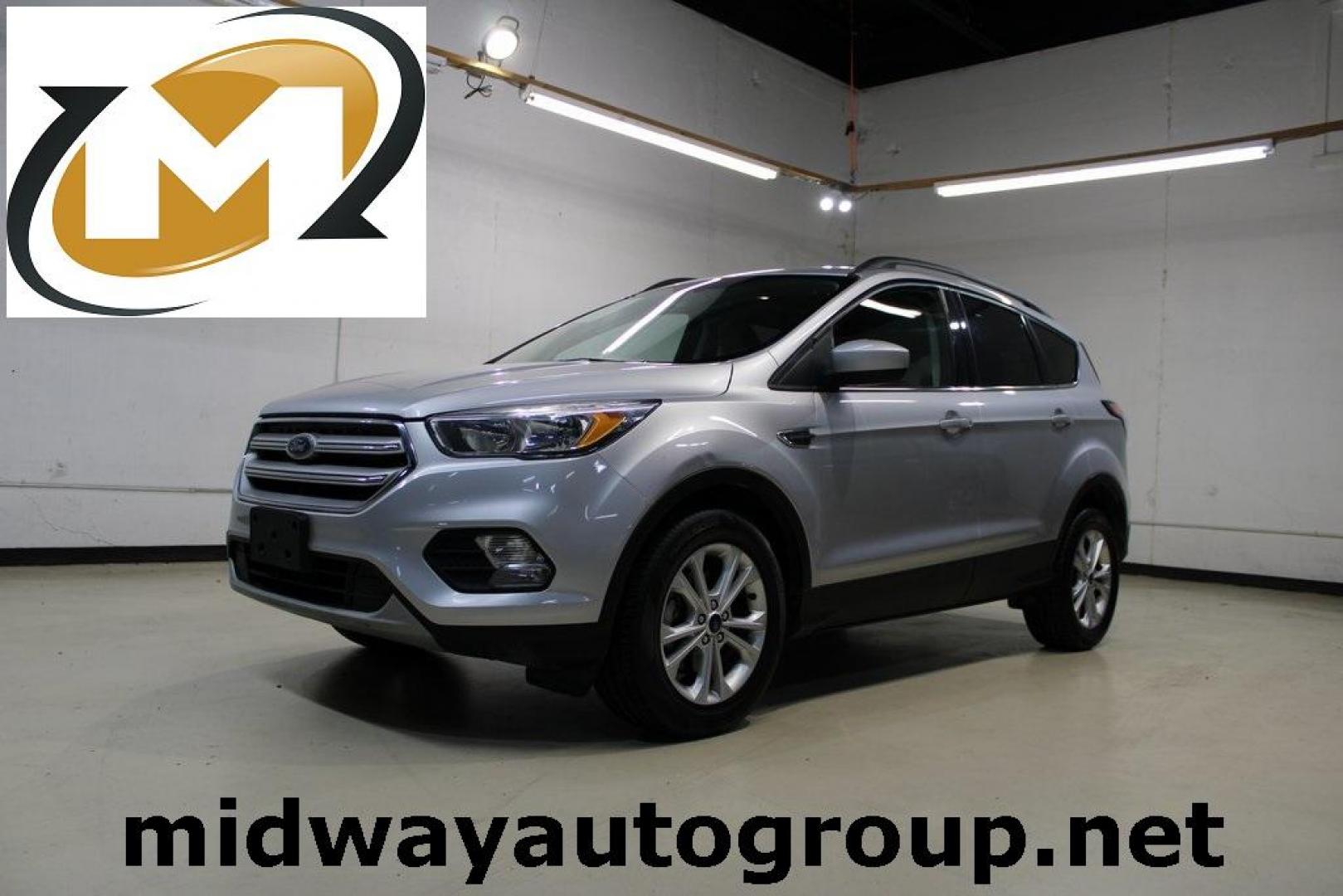 2018 Ingot Silver /Medium Light Stone Ford Escape SE (1FMCU0GD6JU) with an EcoBoost 2.0L I4 GTDi DOHC Turbocharged VCT engine, Automatic transmission, located at 15300 Midway Rd., Addison, TX, 75001, (972) 702-0011, 32.958321, -96.838074 - Photo#0